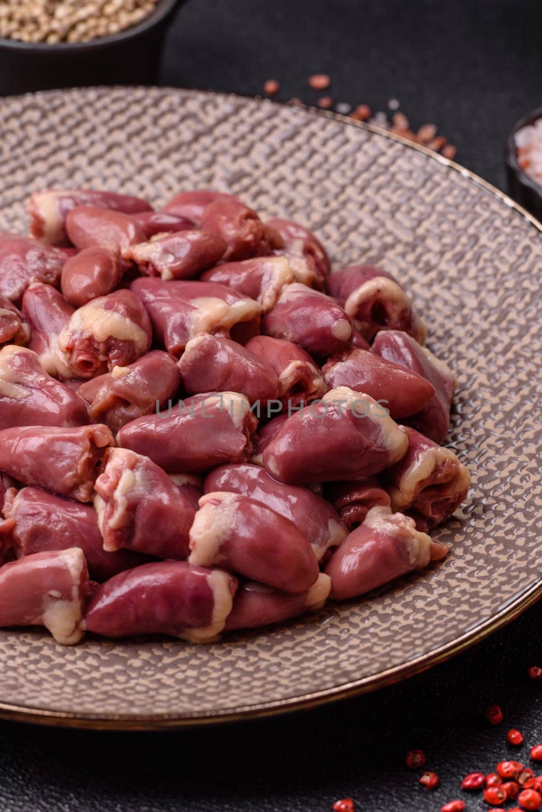 Chicken raw heart, red duck or turkey internal organs as an ingredient for dinner preparation
