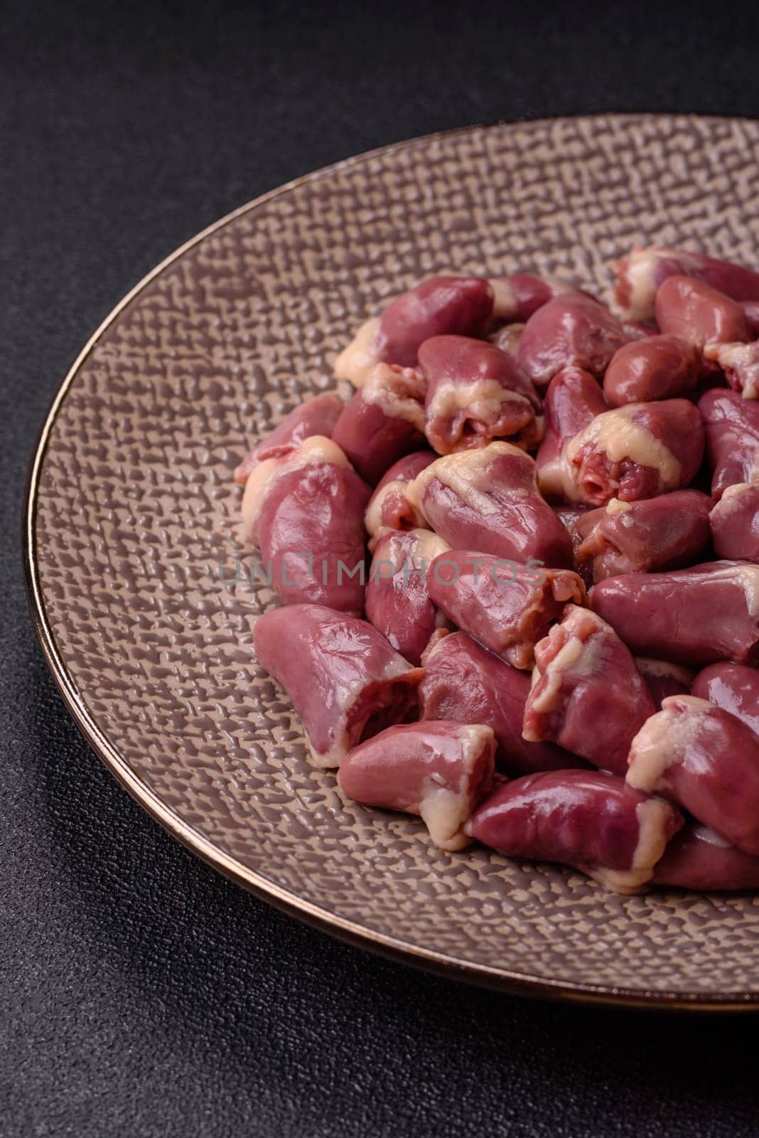 Chicken raw heart, red duck or turkey internal organs as an ingredient for dinner preparation