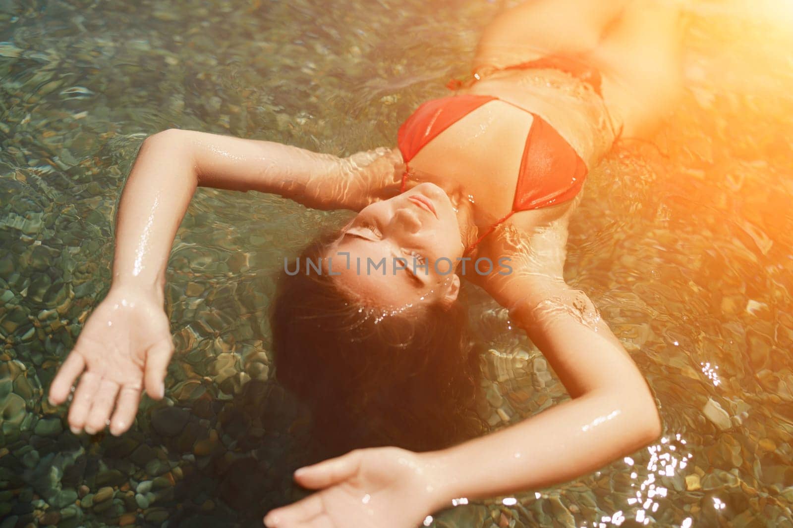 Happy woman sea relaxing floating in transparent sea water on summer holiday. Travel leisure recreation lifestyle, female in nature