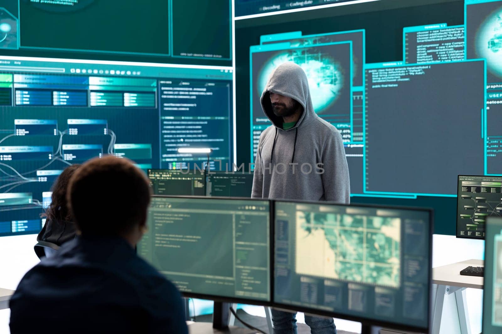 Cyber security expert in a national safety operations center detecting cyber attacks or threats. Governmental hacking team focusing on data protection, cyber operations in progress.