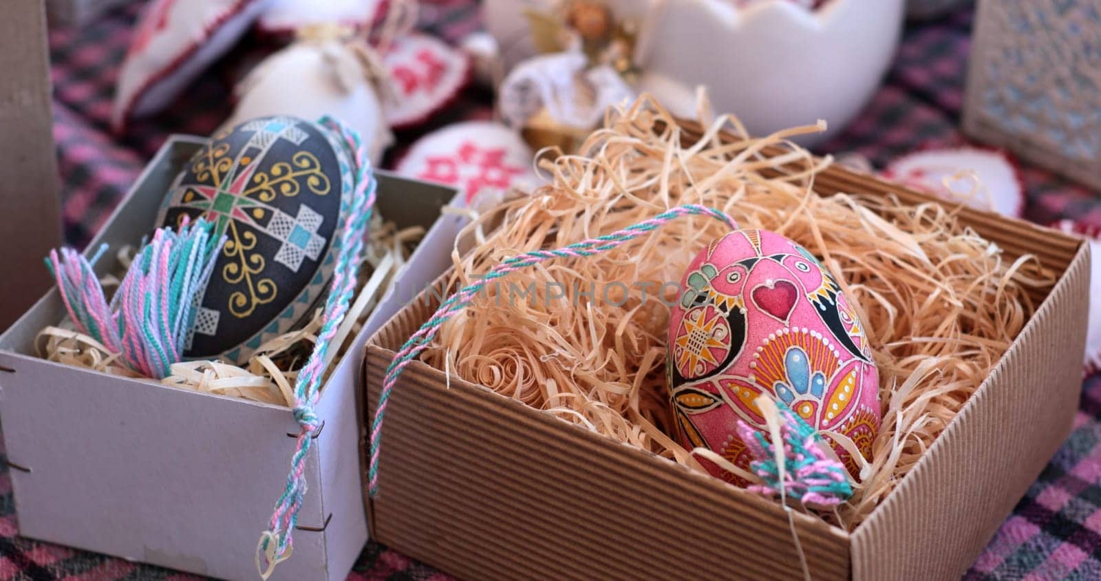 Colorful pysanka eggs arranged in decorative boxes create a charming display for Easter celebrations.