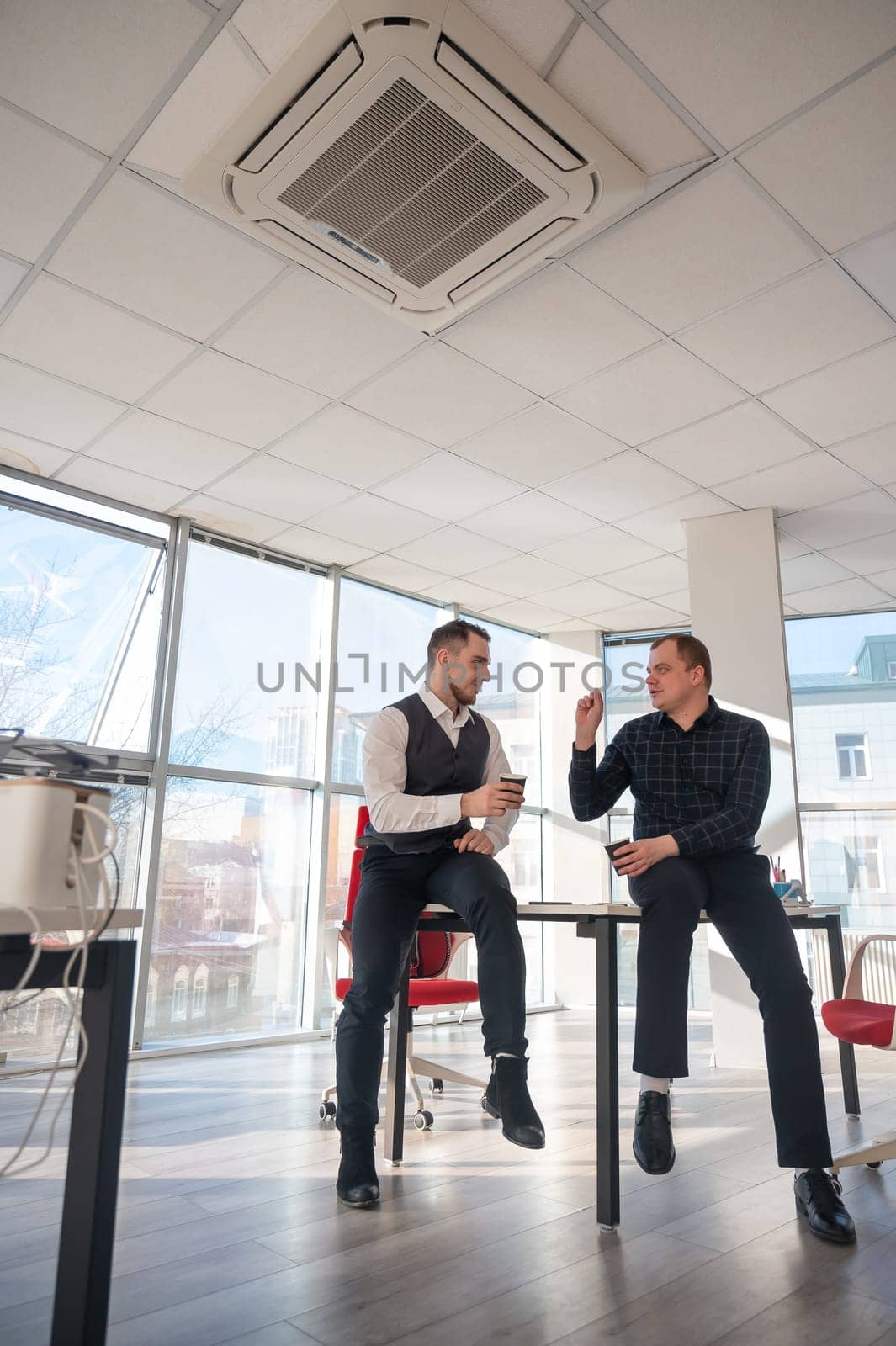 Colleagues drinking coffee in the office