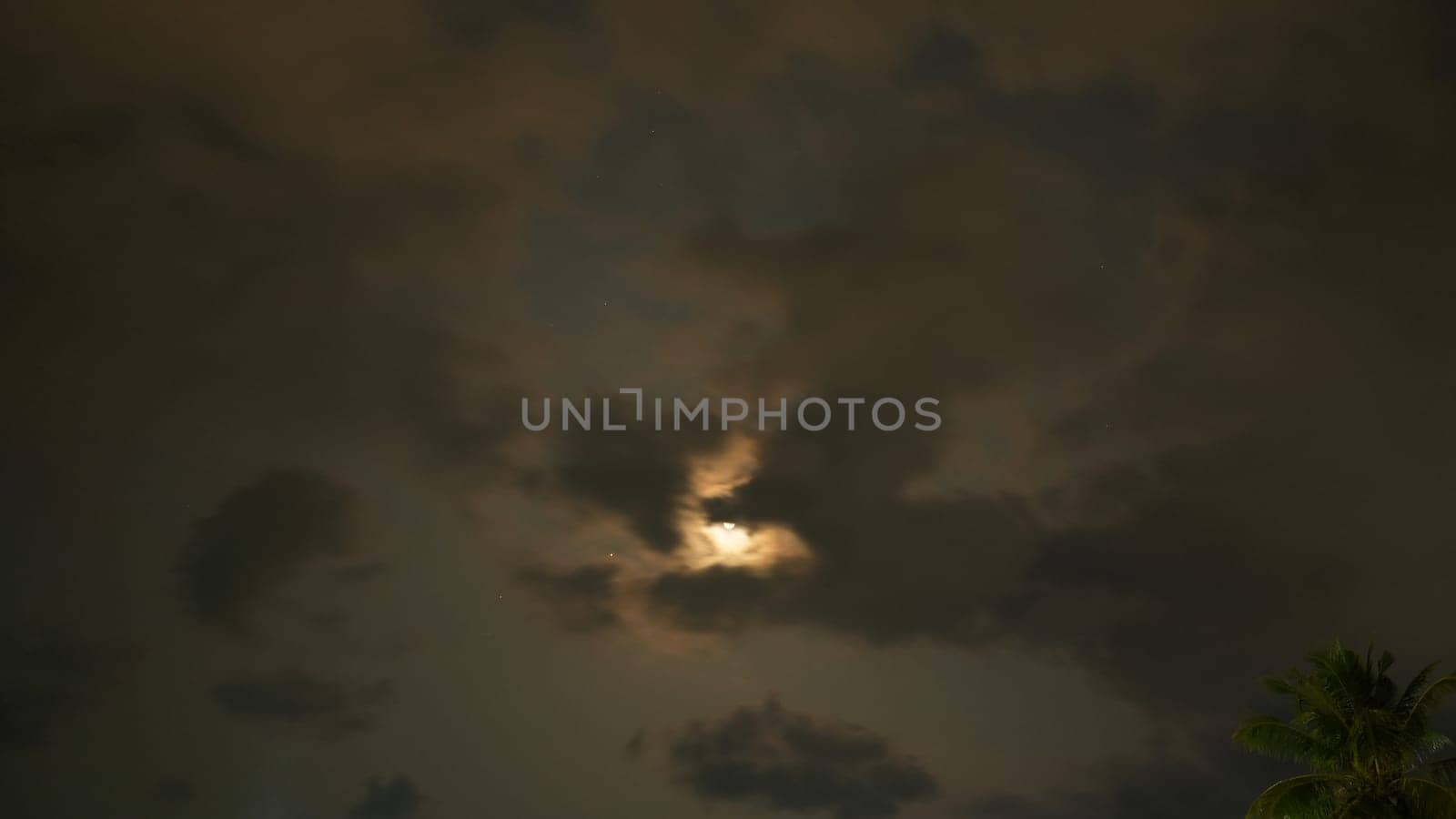 Two dark clouds forming a heart shape with the moon in between, surrounded by stars in a dark night sky, creating a romantic and dreamy atmosphere