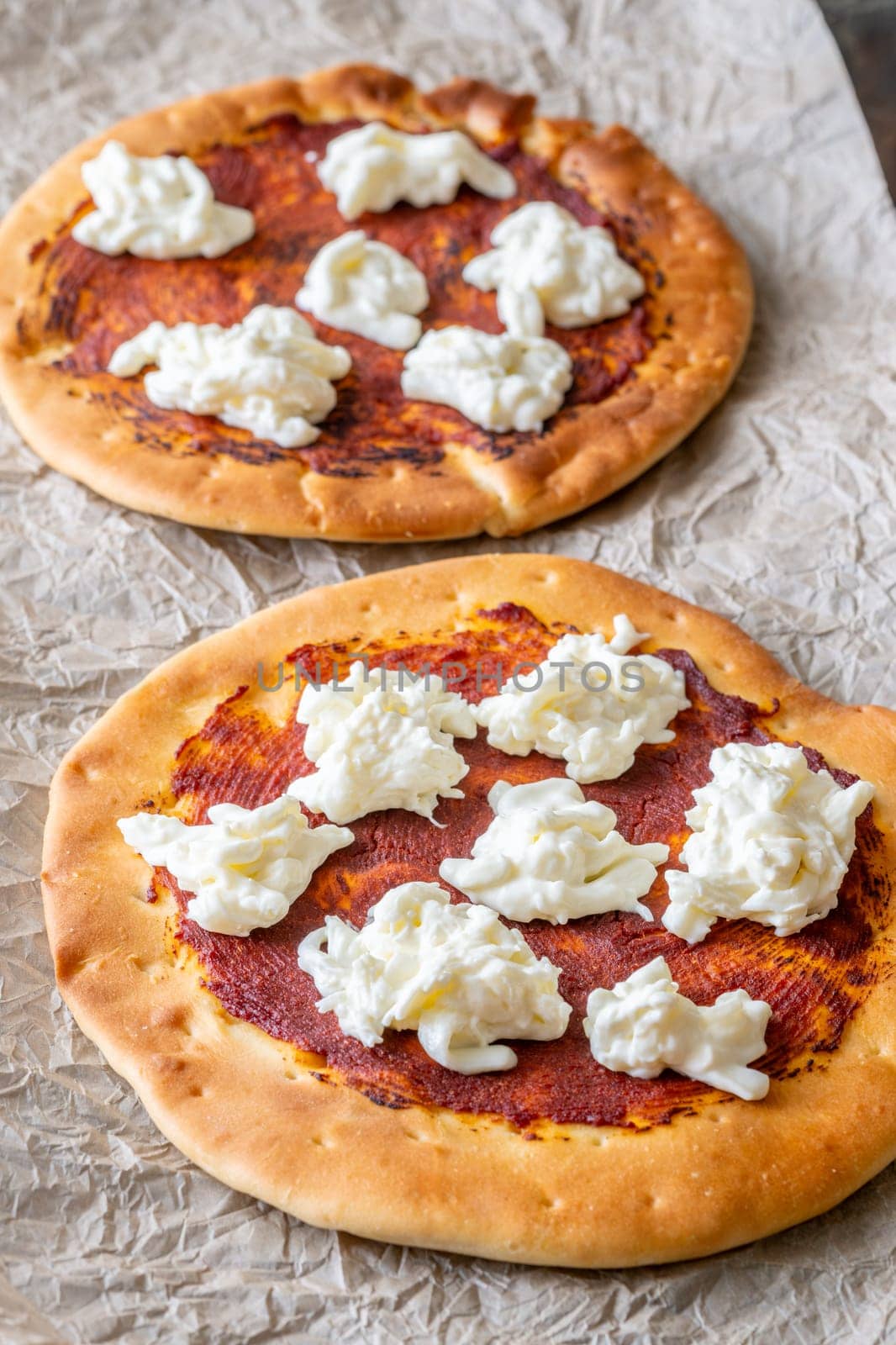 Golden crusts cradle warm stracciatella and sauce, accented with sprigs of thyme