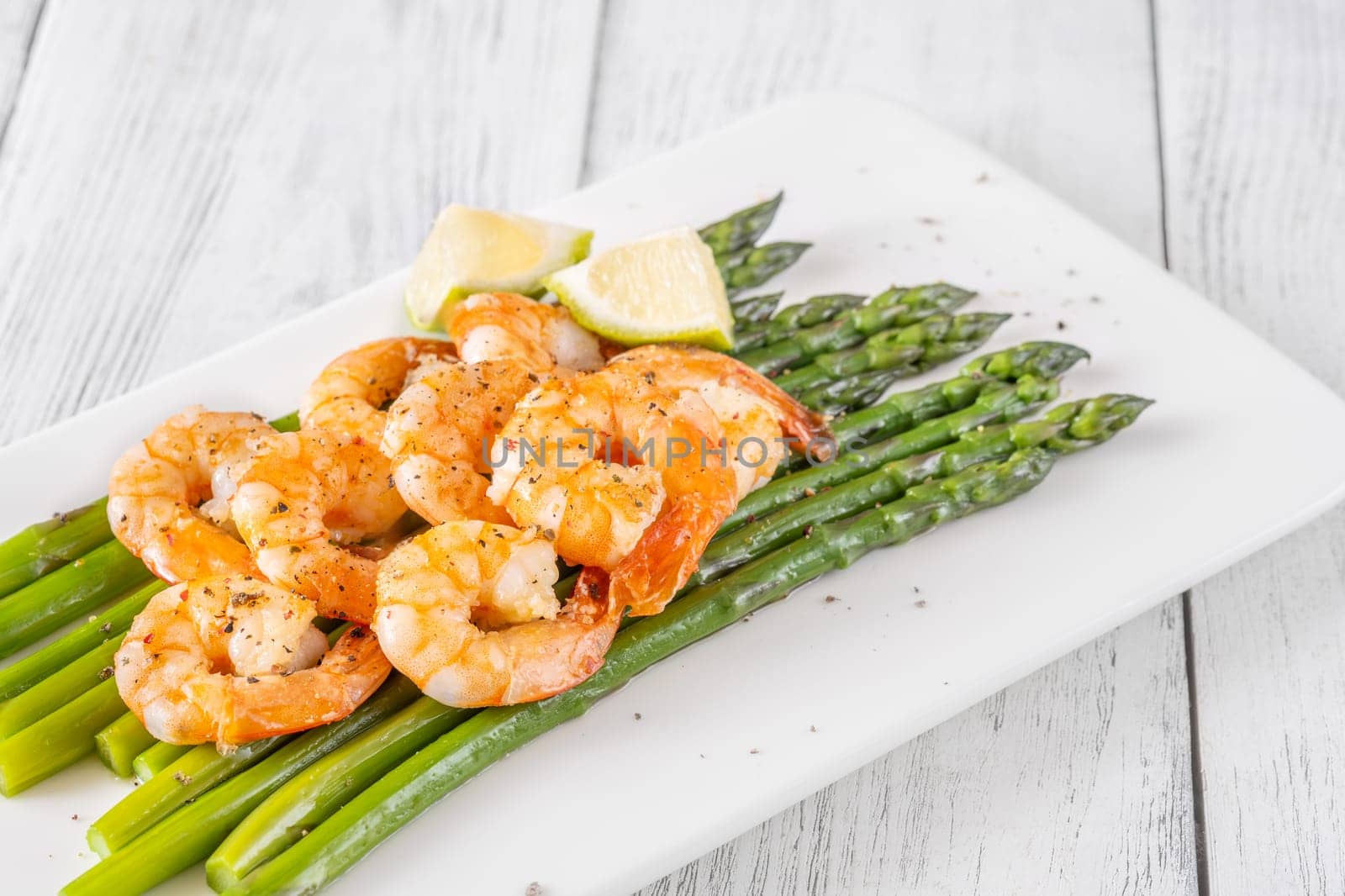 Golden shrimp add crunch and color to soft green spears of asparagus
