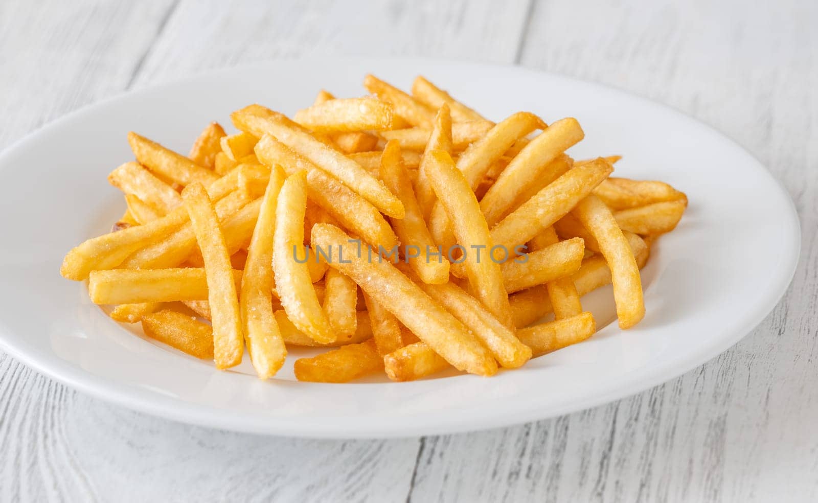 Crisp edges and golden glow highlight the irresistible simplicity of classic fries