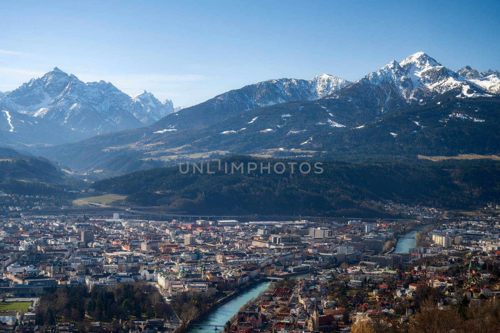 Viiew over Innsbruck city, the Inn river and the alps