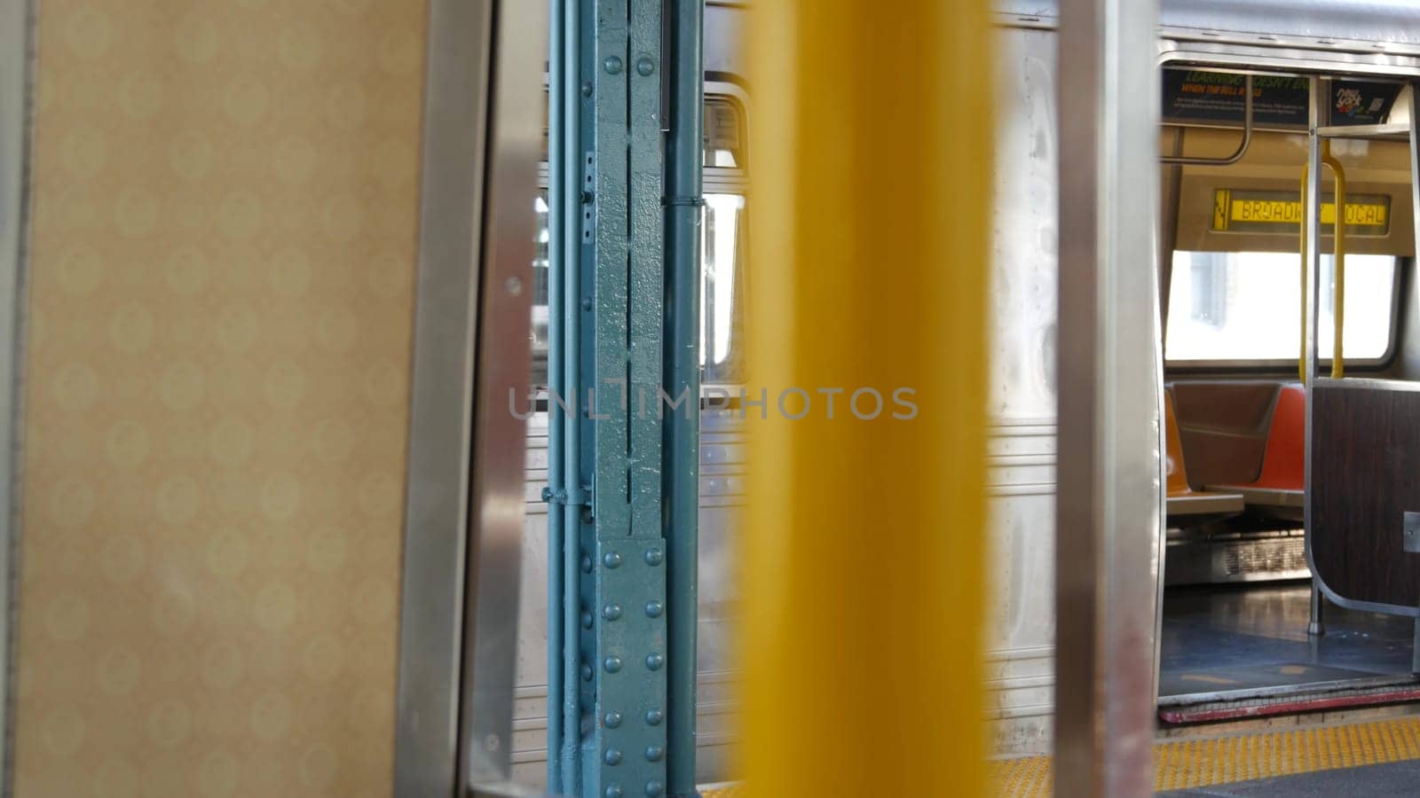 New York City, United States - 2 Sept 2023: Subway train, inside metropolitan wagon. Metro transport, NYC passenger transportation, public underground railway. Railroad traffic. Empty station platform
