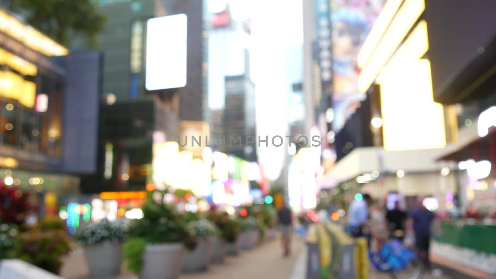 New York City, United States - 14 Sept 2023: Times Square, Manhattan Midtown Broadway street, USA. American NYC urban life. Defocused people. Advertising signs, commercial ads, billboard screens glows