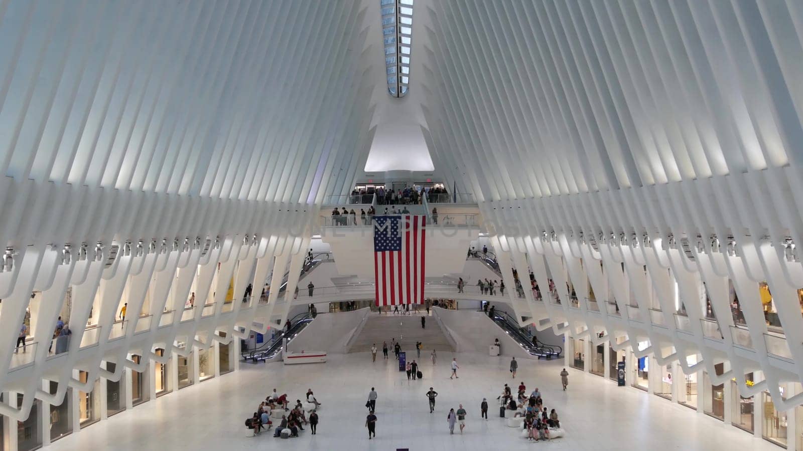 New York City, United States - 10 Sept 2023: World Trade Center Oculus transport hub architecture. Manhattan Downtown Financial District, USA urban life. People. September 11 remembrance american flag