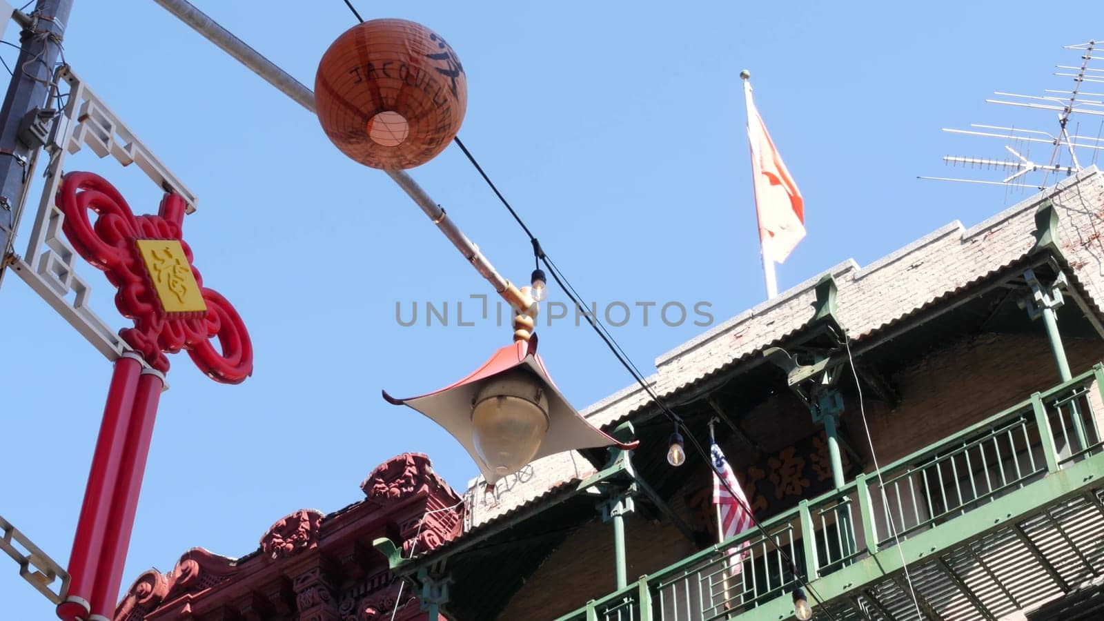 New York City, United States - 14 Sept 2023: Manhattan Chinatown Mott street, chinese ethnic district buildings architecture, USA. American red brick house in little China. Fire escape ladder in NYC.