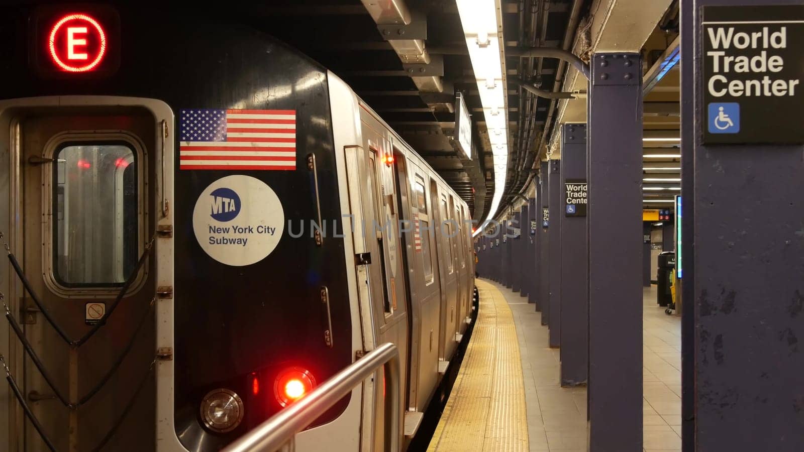 New York, United States - 10 Sept 2023: Subway station, underground metropolitan platform sign. Metro railway passenger public transport. Text signboard World Trade Center. Oculus, Manhattan downtown.