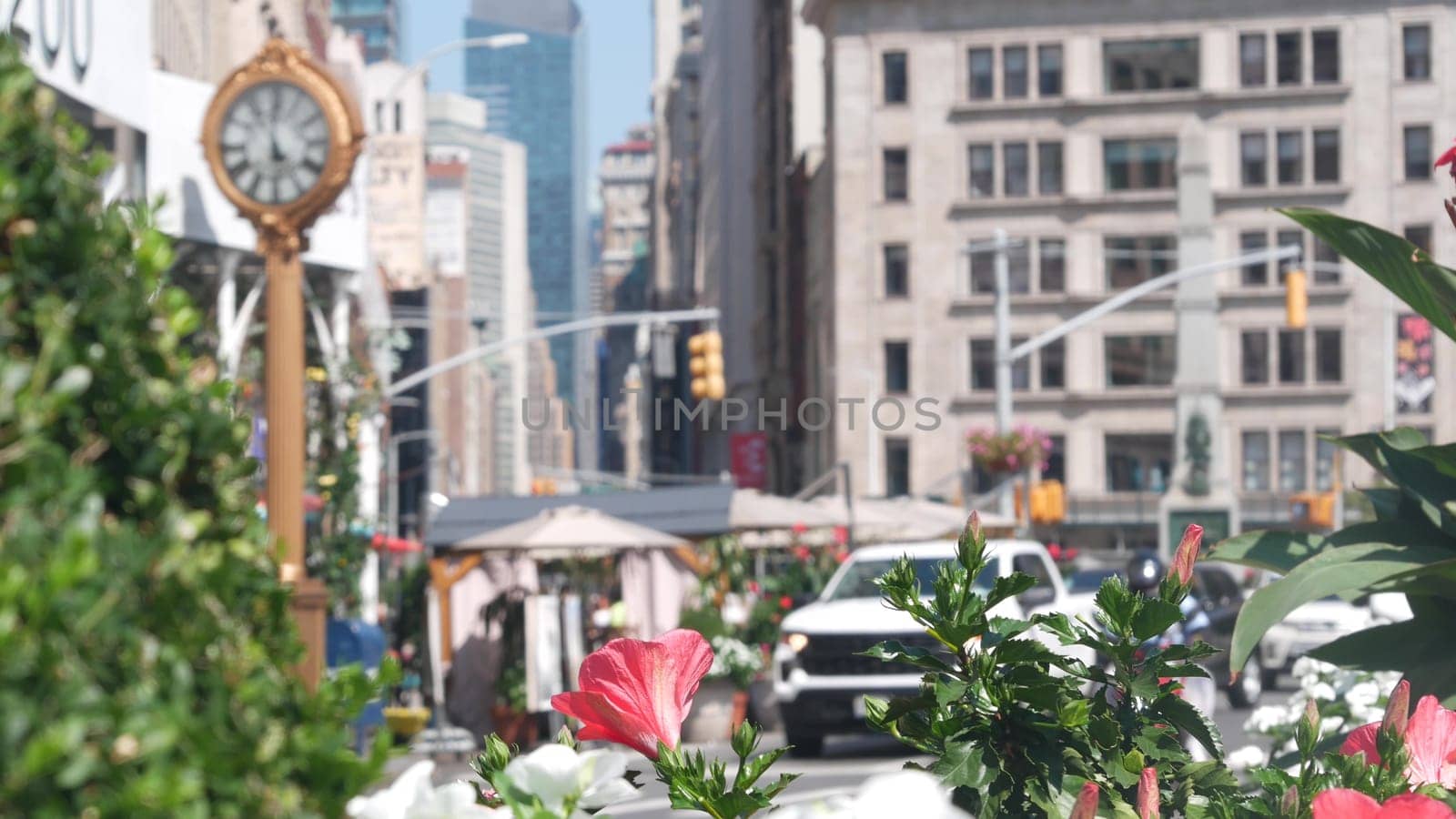 New York City, United States - 6 Sept 2023: Manhattan Midtown Broadway, 23 street, 5 avenue crossroad intersection. Worth Square near Madison Park and Flatiron Building, USA. Porcelanosa, taxi, clock.