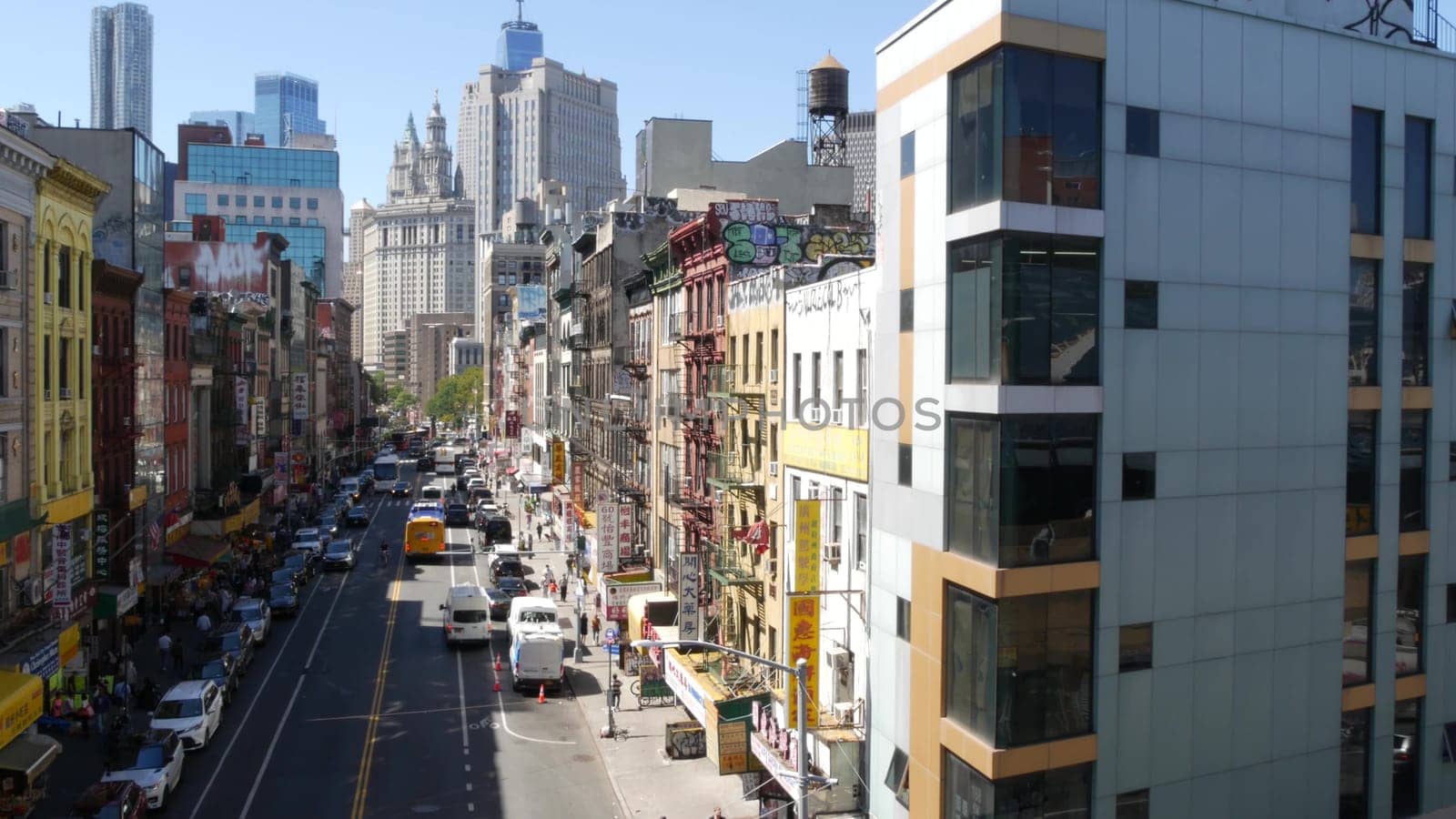 New York City, United States - 14 Sept 2023: Manhattan Chinatown East Broadway street, chinese ethnic district architecture, little Fuzhou, USA. World trade Center tower in Downtown. Manhattan Bridge.
