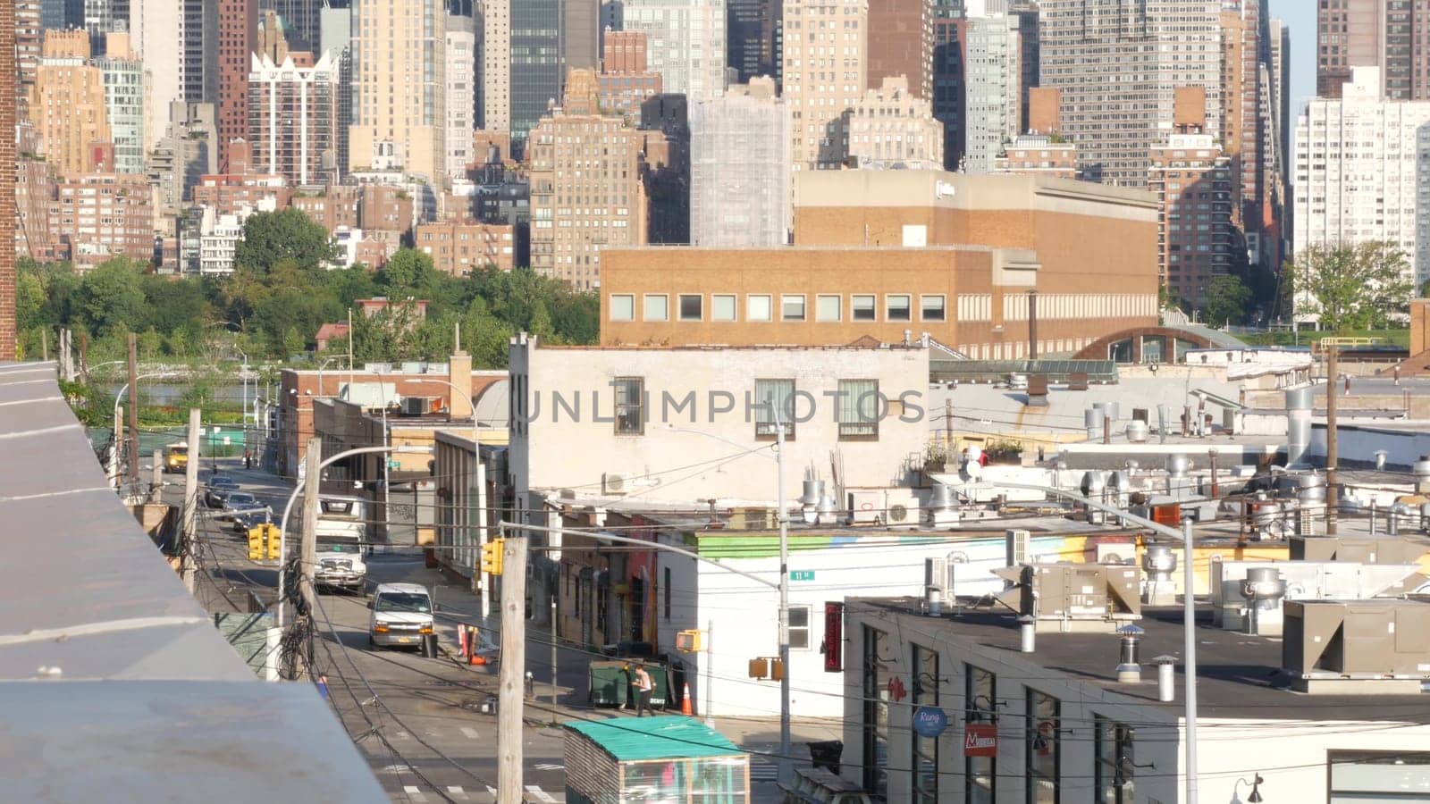 New York City, United States - 2 Sept 2023: Manhattan skyline cityscape. Rooftop view from Queens to Midtown, roof in Long Island. NYC urban architecture, Hunters Point. Residential buildings by river