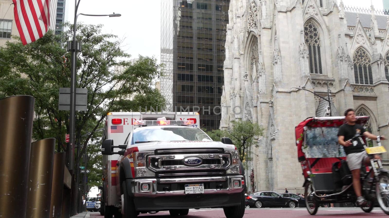 New York City, United States - 13 Sept 2023: NYFD Ambulance medical emergency, american fire department paramedic truck siren, Manhattan 5 fifth avenue. USA 911 vehicle on street. NYC first responders