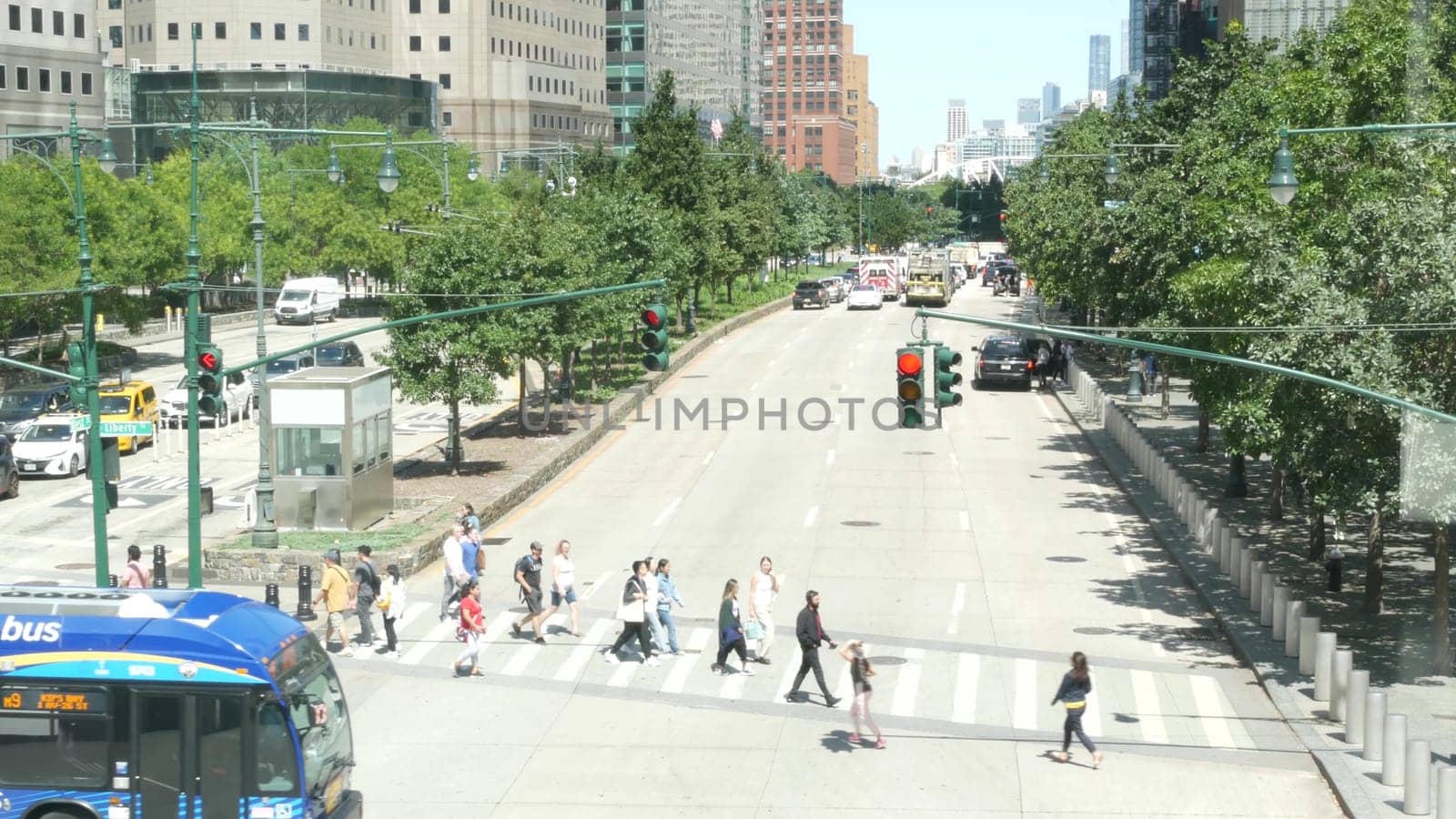 New York City, United States - 31 Aug 2023: Manhattan Downtown Financial District street crossroad intersection. Urban road car traffic. People pedestrian on zebra. World Trade Center memorial area.