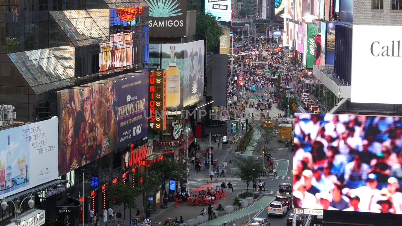 New York City, United States - 14 Sept 2023: Times Square, Manhattan Midtown Broadway street, USA. American NYC urban road traffic, people from above. Commercial illuminated billboard screens glowing.
