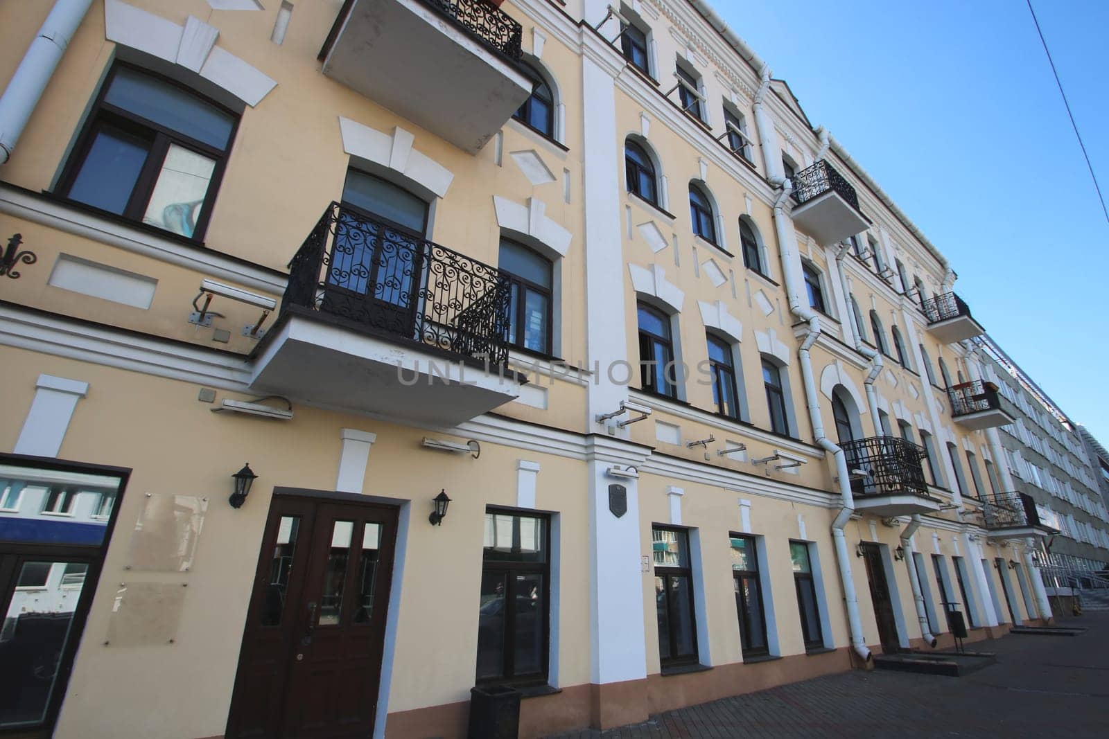 A sizable and impressive building that features a scenic balcony located on the very top floor, providing a great view of the surroundings