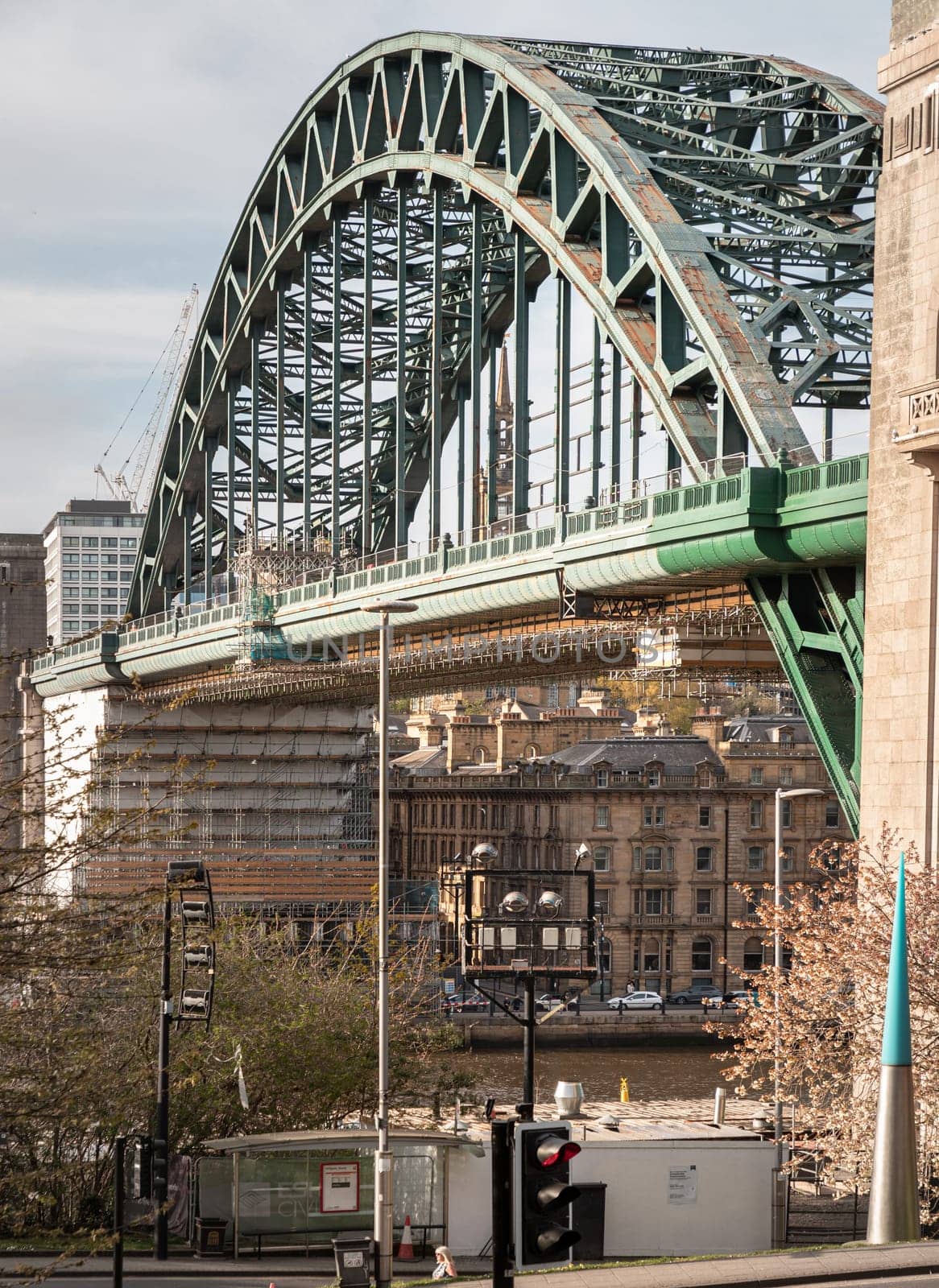 Newcastle, UK - Apr 11, 2025 - A view of Tyne Bridge featured at a dynamic angle showing the parabolic arch of the bridge spanning spanning the River Tyne in Newcastle Upon Tyne in the North East of England. use it as your Wallpaper, Poster and Space for text, Selective focus.