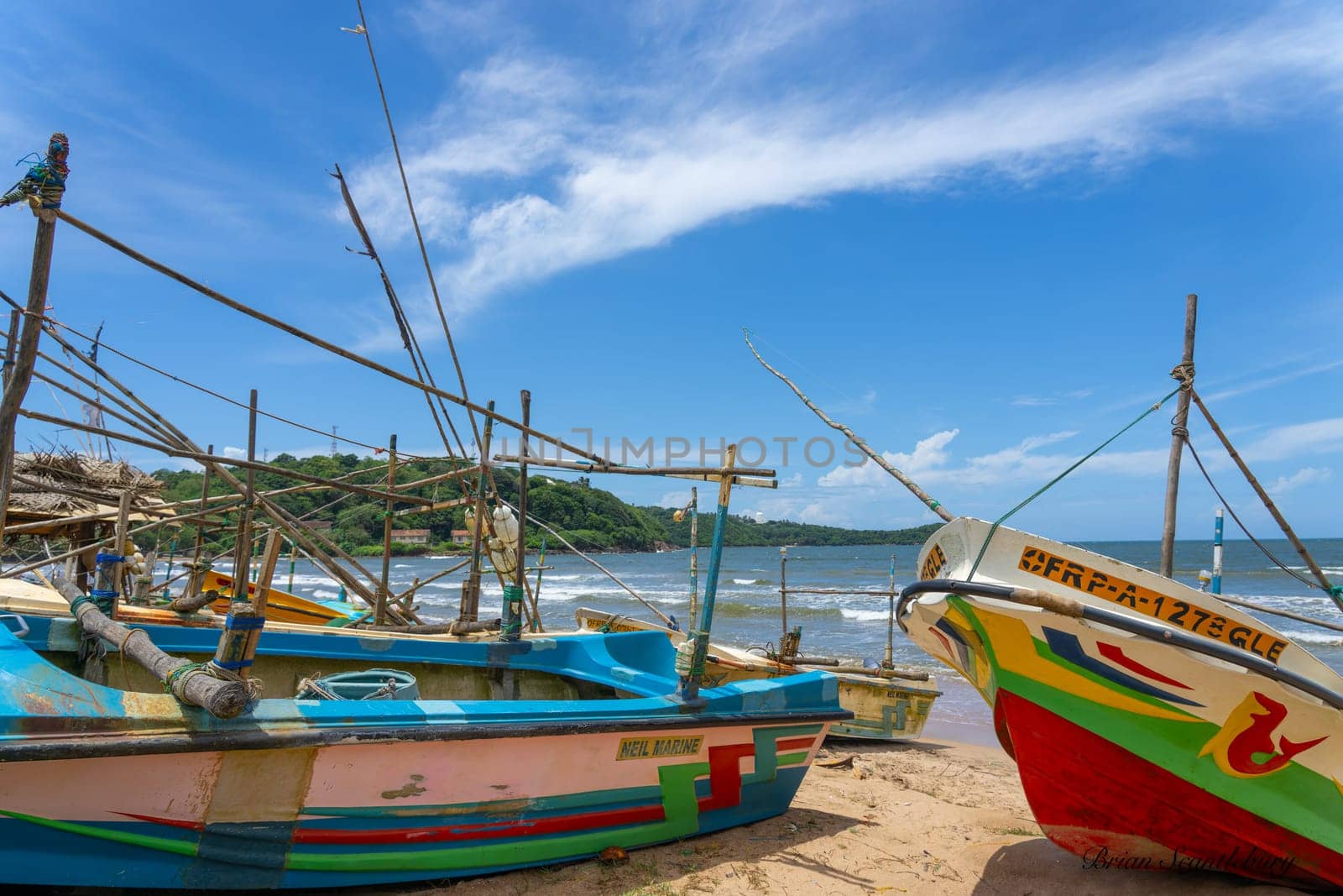 Galle Sri Lanka - September 14 2024; Traditional picturesque style fisherman’s boats pulled up on sand at beach near city.