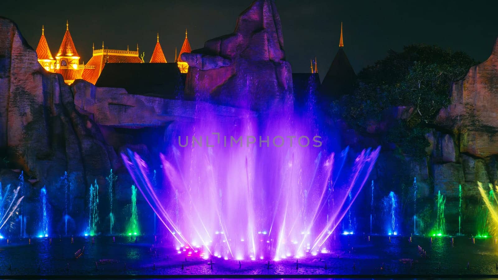 beautiful bright illuminated dancing and singing fountains at night. Musical performance show
