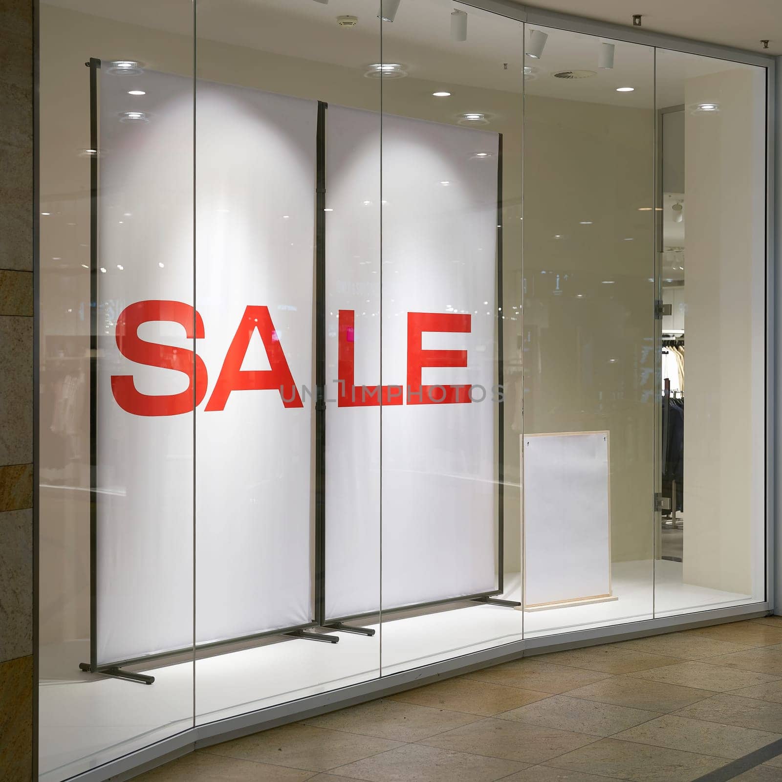 Illuminated shop window with the lettering Sale in the city center of Dresden, Germany