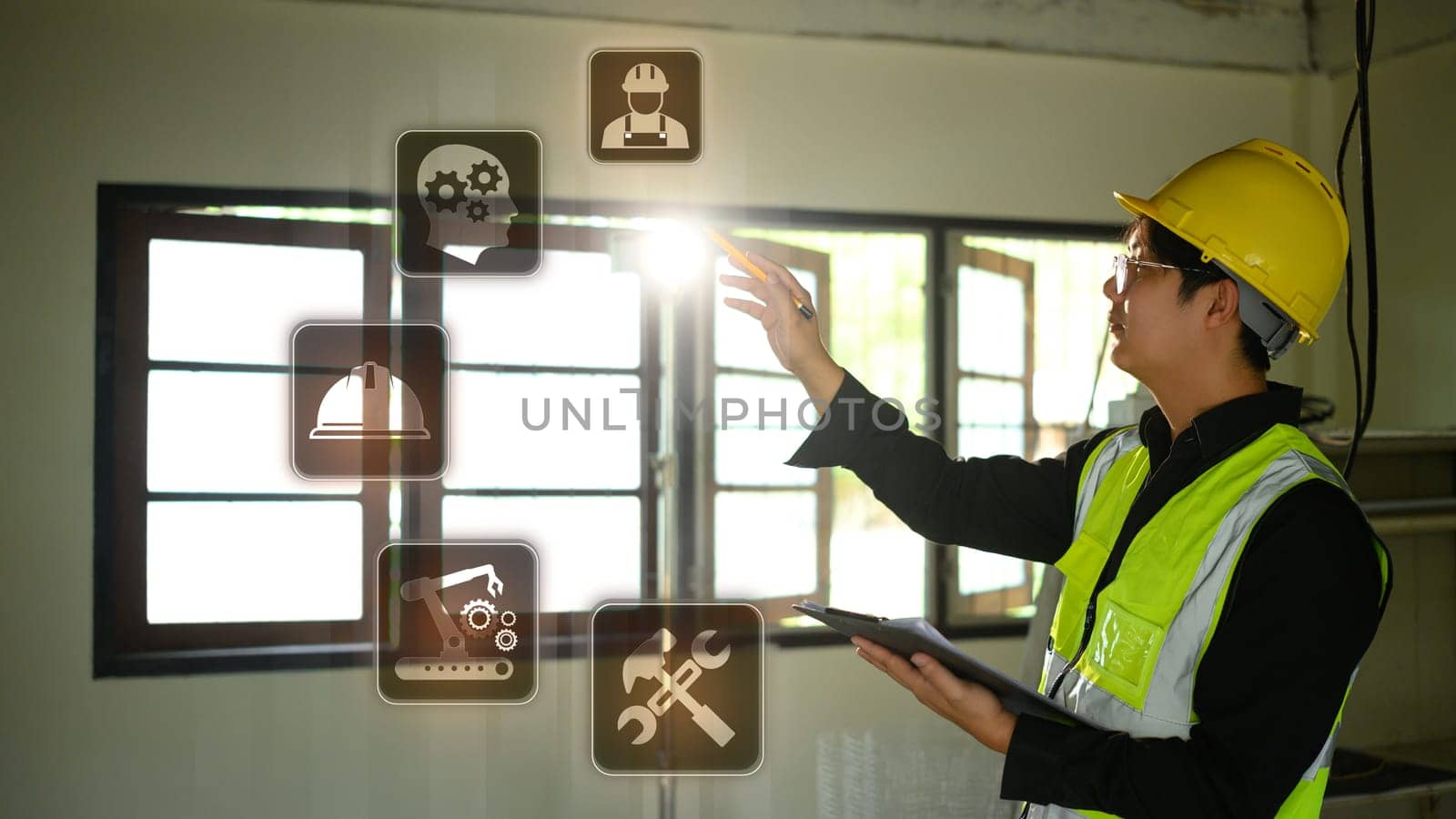 Futuristic smart construction concept with male engineer operating holographic controls.