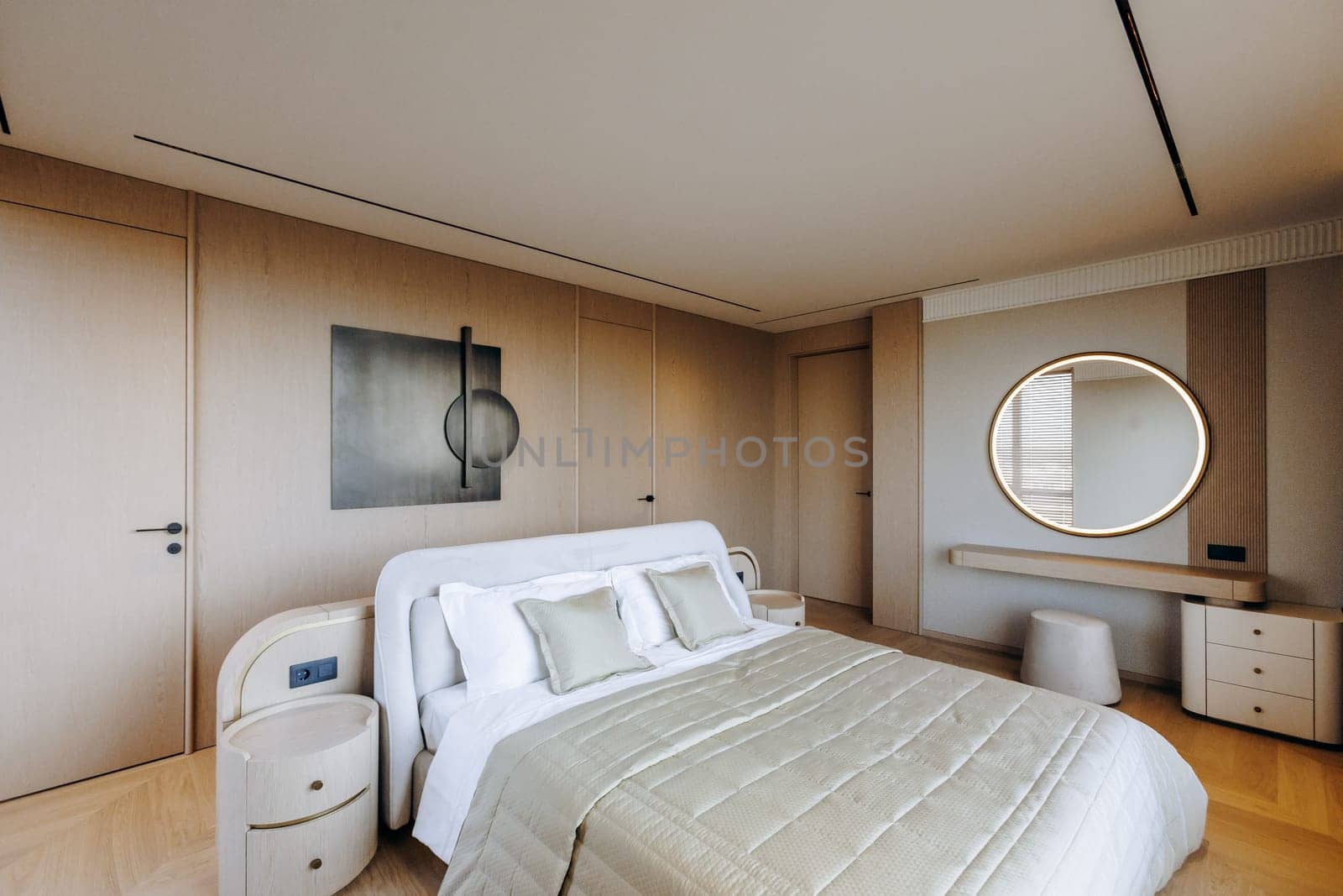 Unwind and relax in this chic and minimalist bedroom, showcasing stylish decor and soothing, calming colors