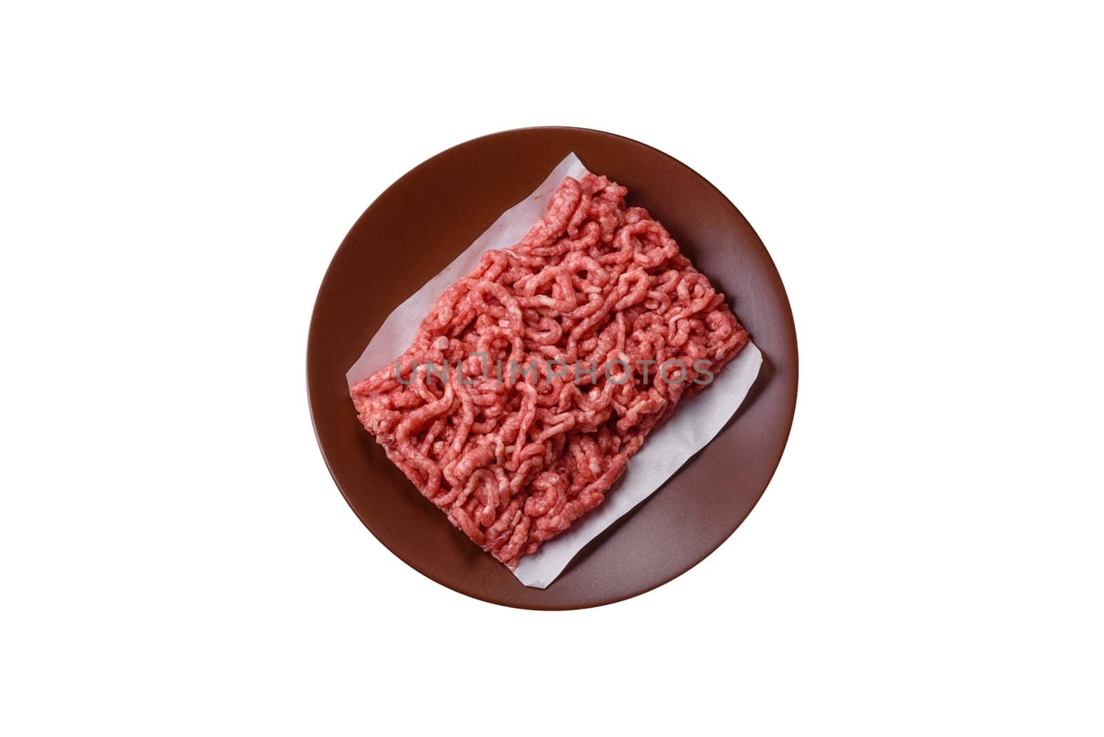 Stuffing or ground raw beef or pork with salt and spices on a black background