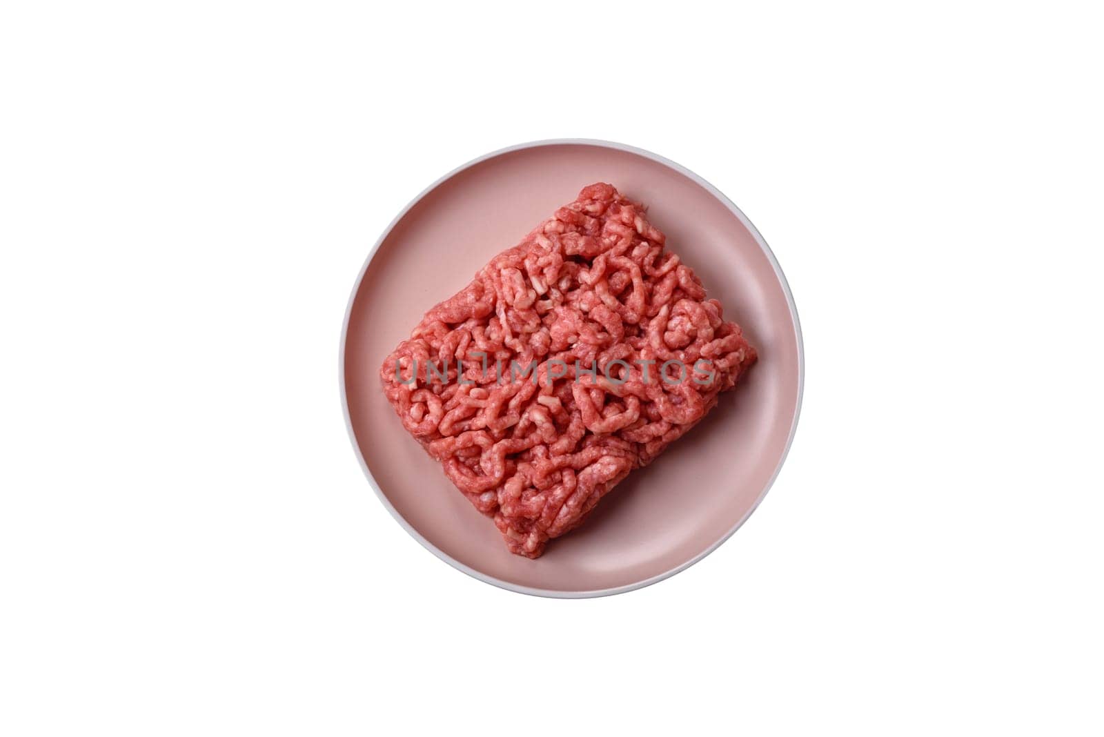 Stuffing or ground raw beef or pork with salt and spices on a black background