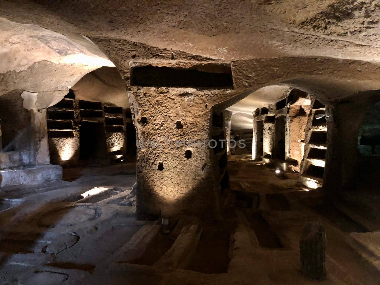 The Catacombs of San Gennaro are underground paleo-Christian burial and worship sites in Naples, Italy, carved out of tuff, a porous stone.