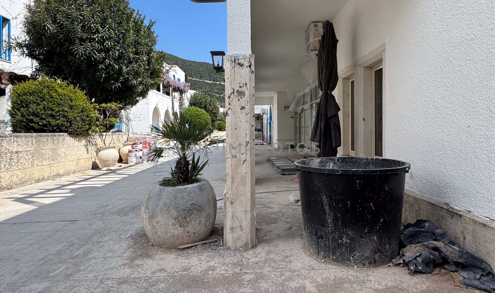 Budva, Montenegro - April 17, 2025: On the exterior of the renovated MAGNOLIA Healthy Bar building, thickets of plants and debris are visible, highlighting the theme of the renovation.