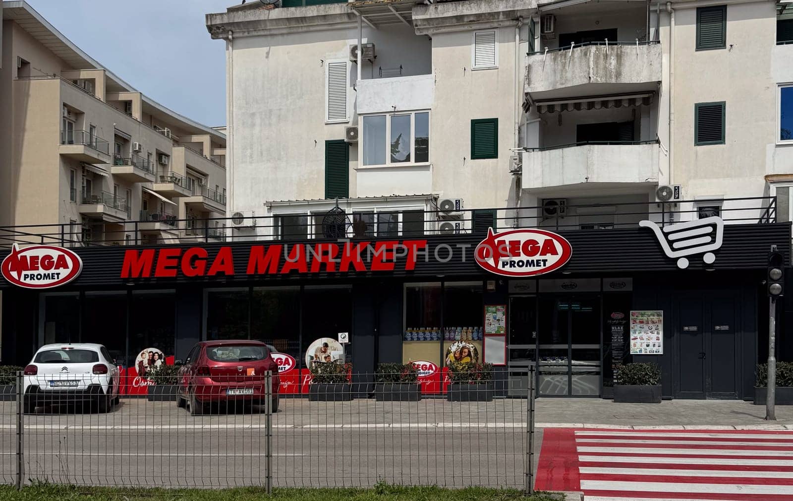 Budva, Montenegro - April 18, 2025: Mega Market shop window located on Jadranski Put Street