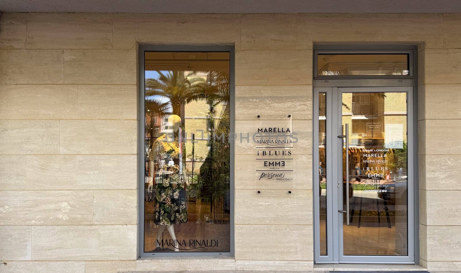 Budva, Montenegro - April 18, 2025: Front door of Marina Rinaldi Boutique. elegant fashion and a welcoming concept
