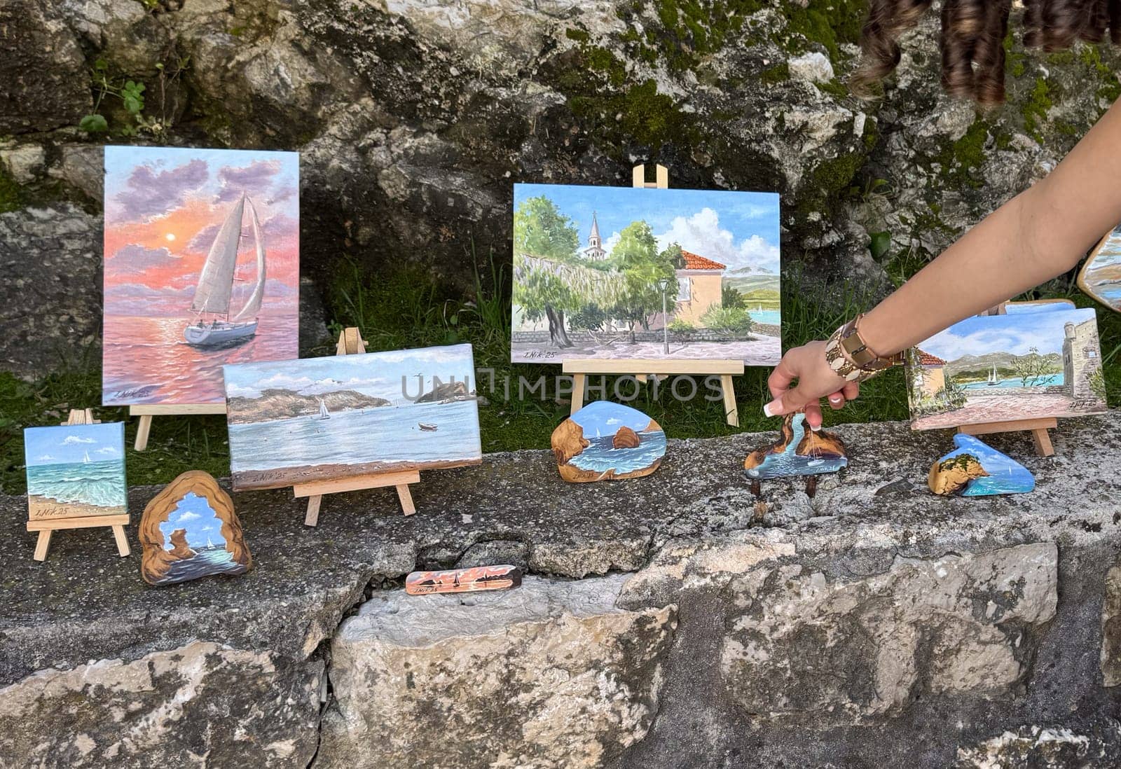 Budva, Montenegro - April 18, 2025: An exhibition of the artist's coastal paintings showcasing creativity and the concept of inspiration