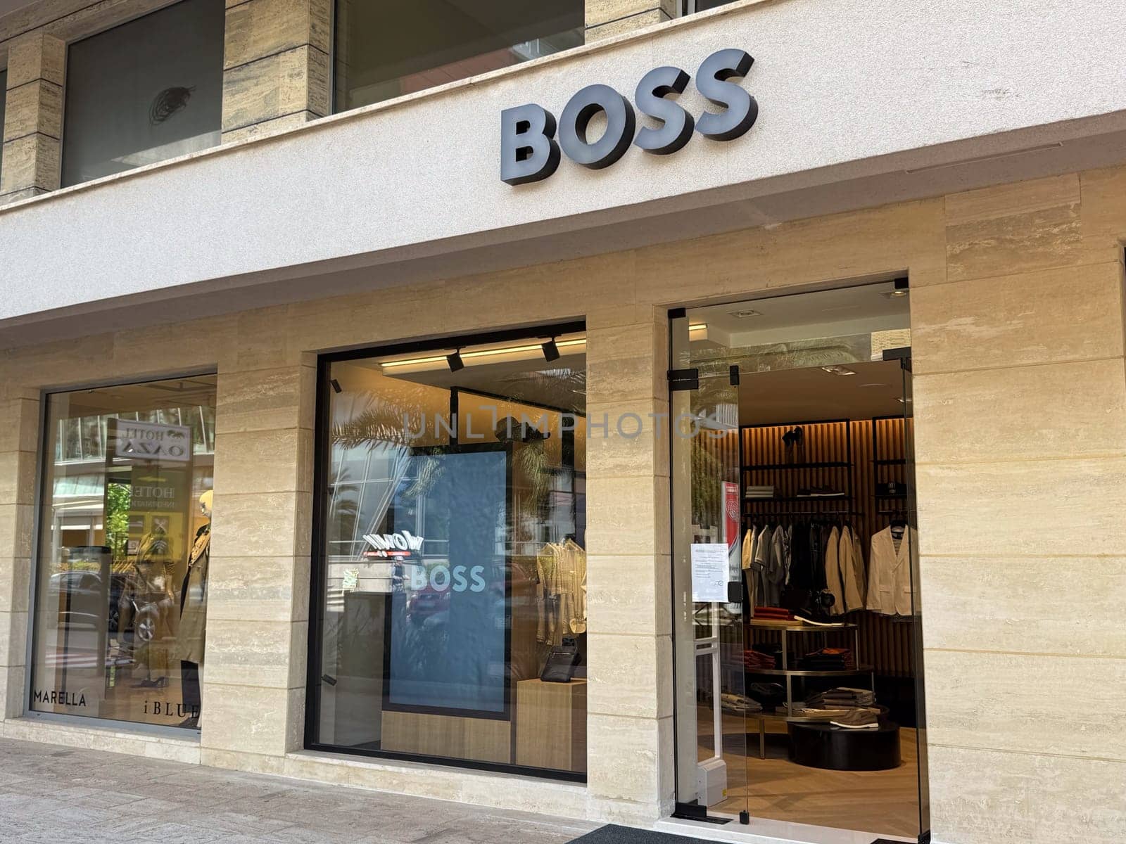 Budva, Montenegro - April 18, 2025: BOSS retail store exterior highlights contemporary fashion and design within an urban shopping area