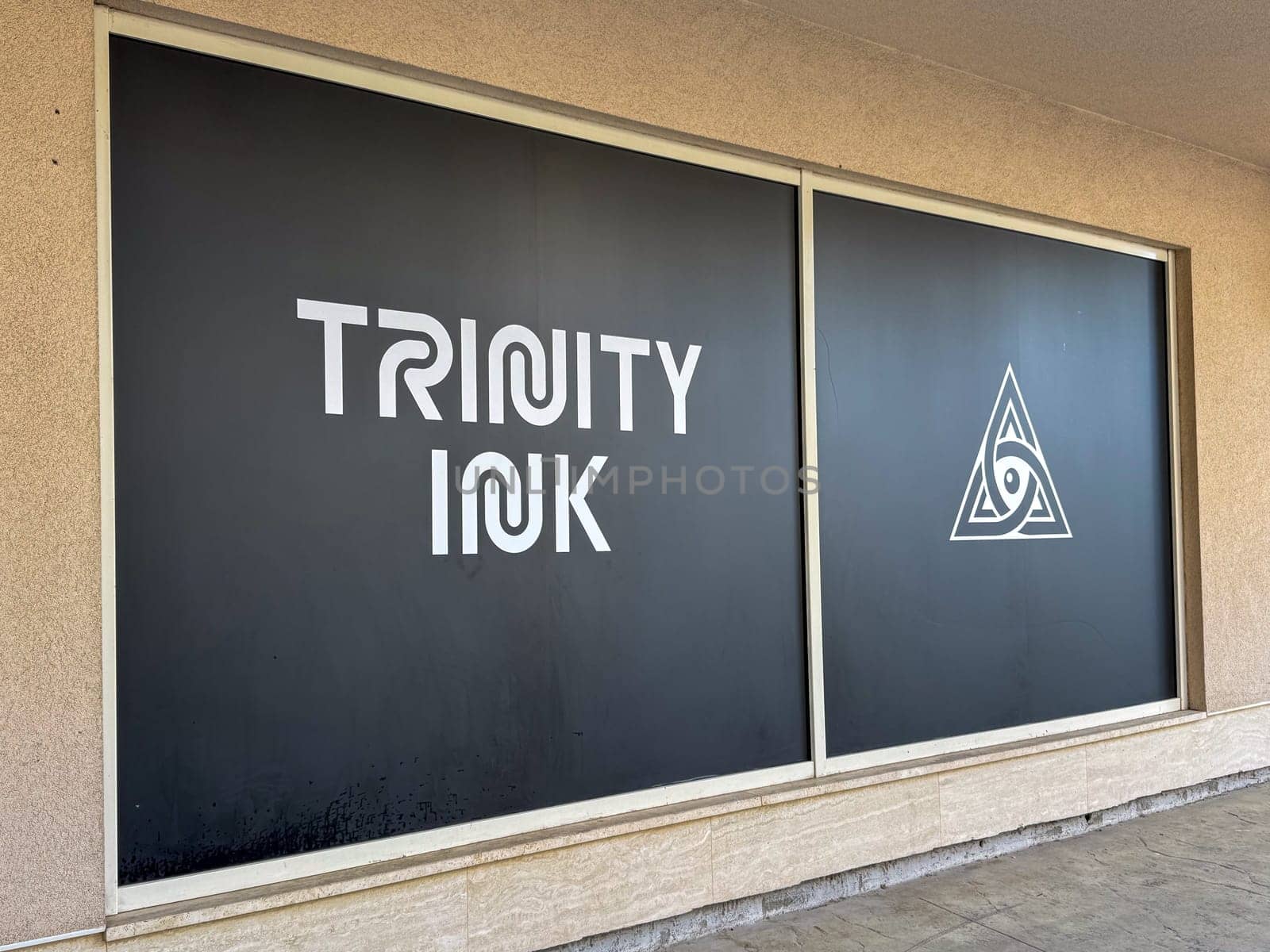 Budva, Montenegro - April 18, 2025: Budva, Montenegro - April 18, 2025: Trinity Ink Tattoo Studio Showcase