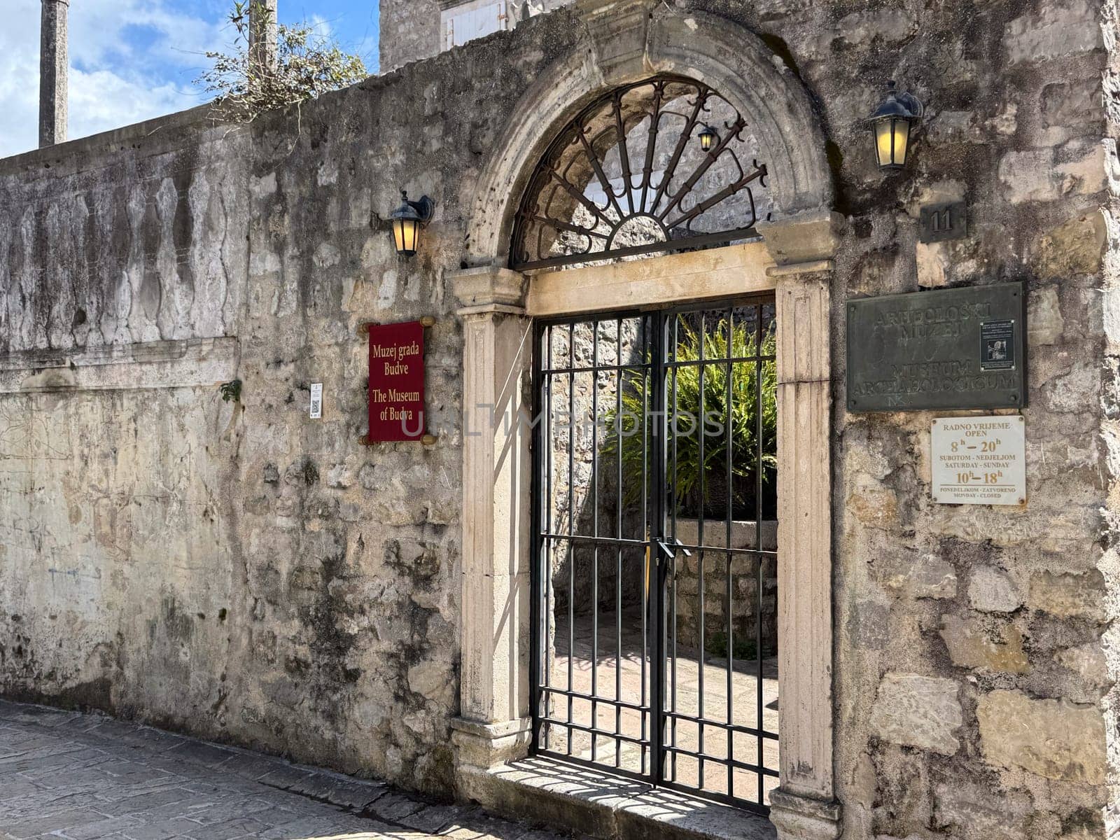 Budva, Montenegro - April 18, 2025: Historical entrance to the Museum of the History of Budva, showcasing the concept of cultural heritage