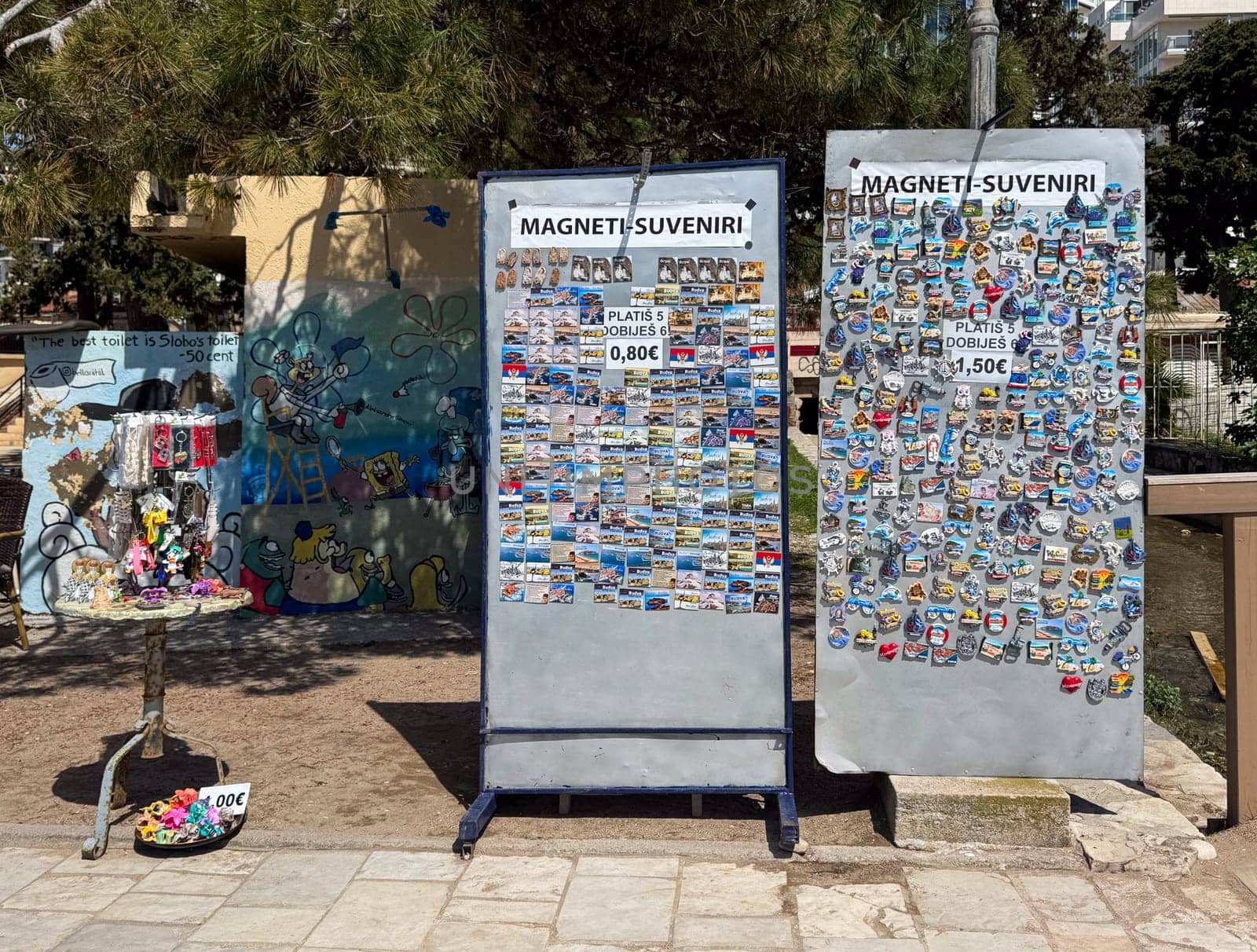 Budva, Montenegro - April 18, 2025: The souvenir magnet exhibition highlights local culture and craftsmanship on the open-air promenade, inviting visitors to experience unique souvenirs and memories