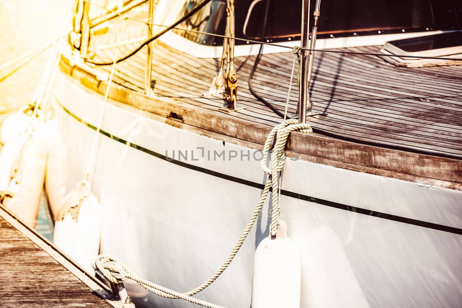 Sailboat deck ropes closeup with sunlight reflecting, suitable for nautical theme background