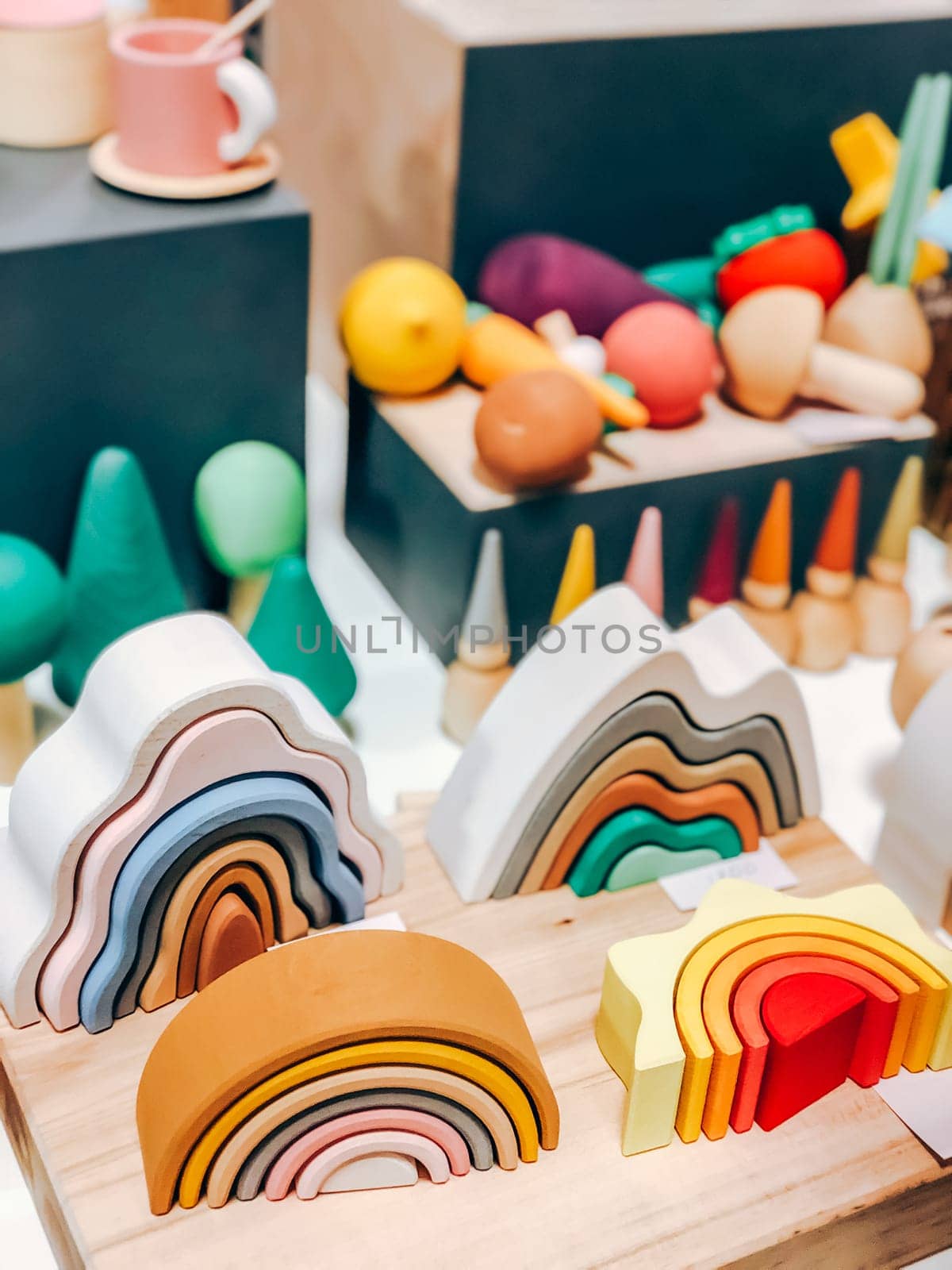 Colorful wooden rainbow toys and shapes for playful decor in playroom setting