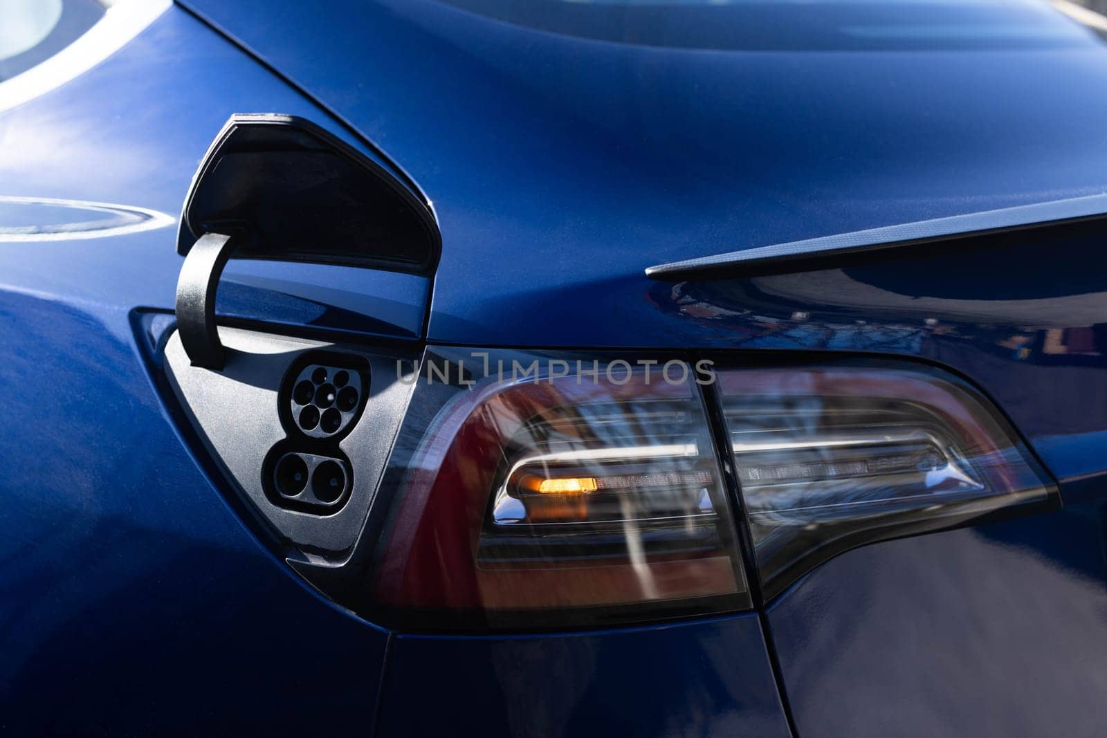 Fast charging socket type 2 combo electric car. Type 2 CCS plug port on electric vehicle. DC - CCS type 2 EV charging connector at EV car. Eco friendly alternative energy green environment concept