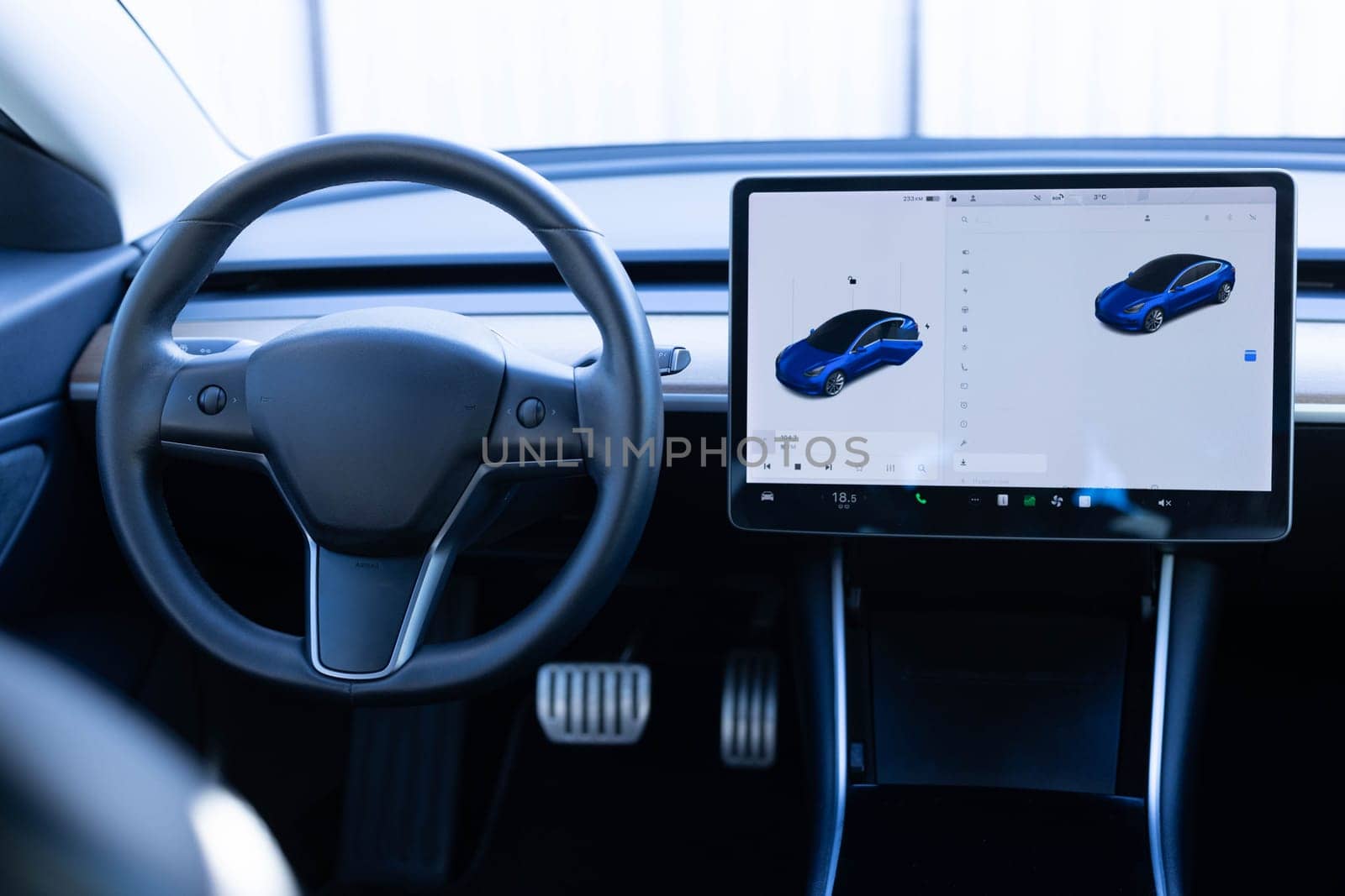 Electric car interior luxury. Interior of prestige modern car. Leather comfortable seats, dashboard and steering wheel. Cockpit with exclusive decoration.