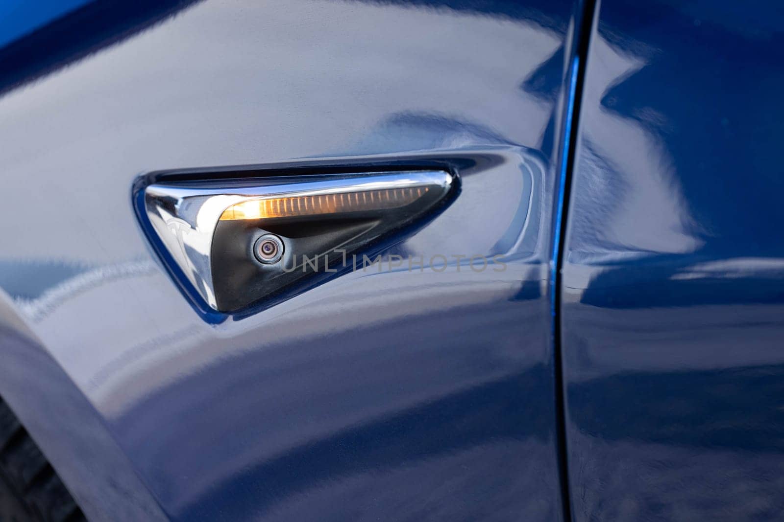 Lviv, Ukraine - April 17, 2025: Autonomous self-driving Tesla Model 3 performance autopilot. Ultrasonic sensors, cameras and radar. Technology of artificial intelligence helps a car to park itself.