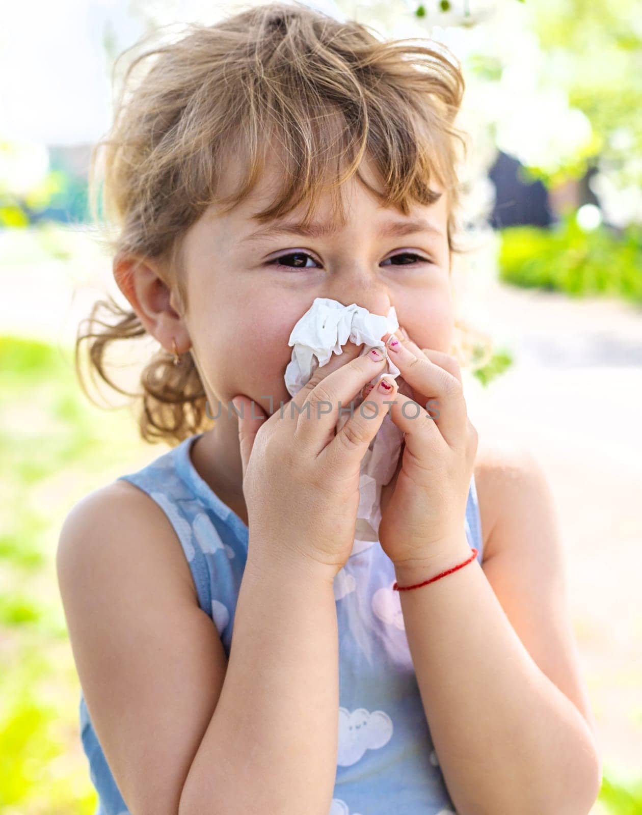 child allergic to flowering trees. Selective focus. kid.