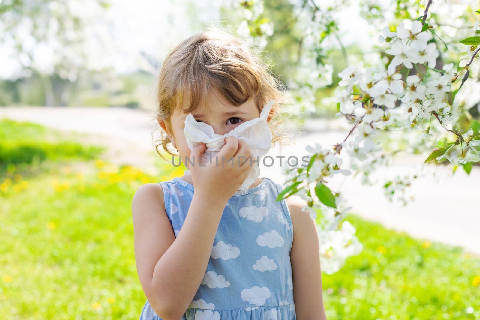 child allergic to flowering trees. Selective focus. kid.