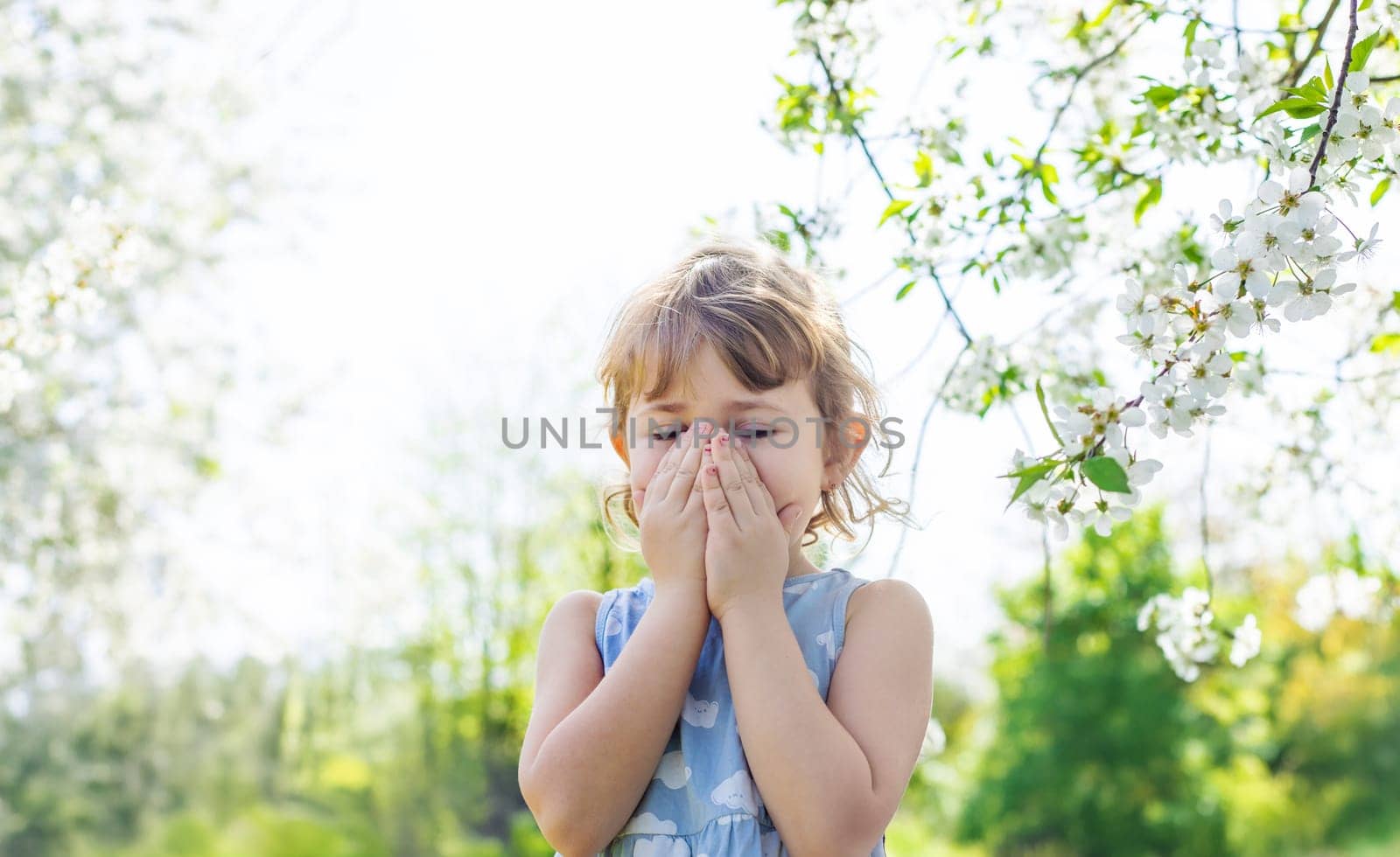 child allergic to flowering trees. Selective focus. kid.