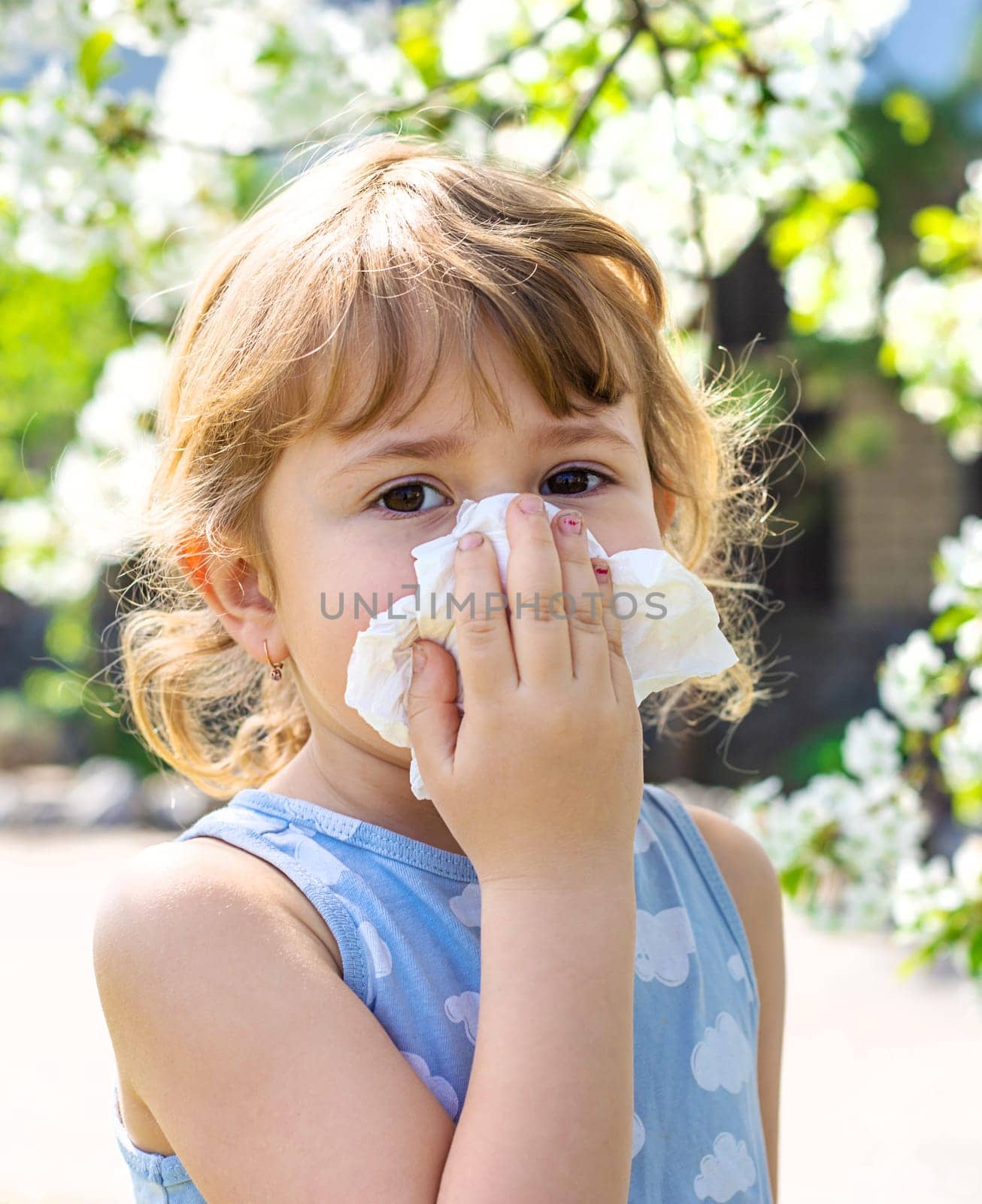 child allergic to flowering trees. Selective focus. kid.
