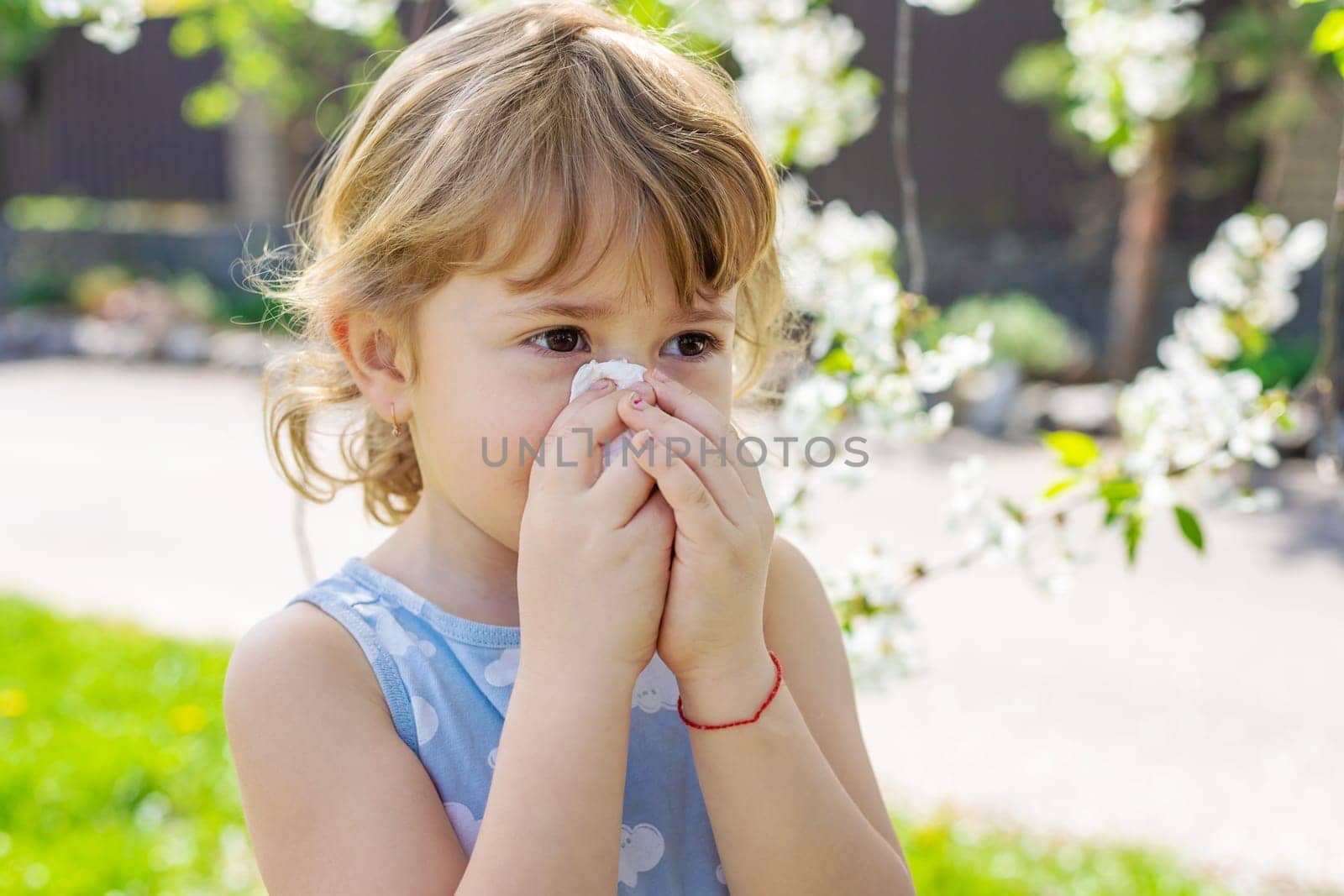child allergic to flowering trees. Selective focus. kid.